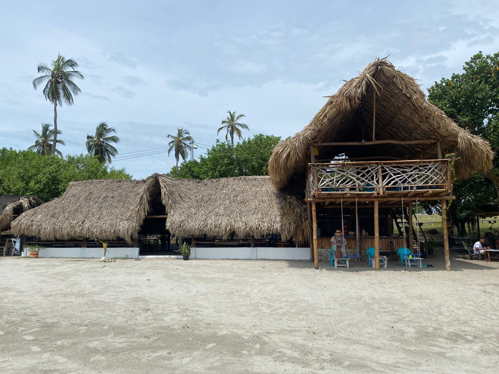 an abstract photo of a curved building with a blue sky in the background