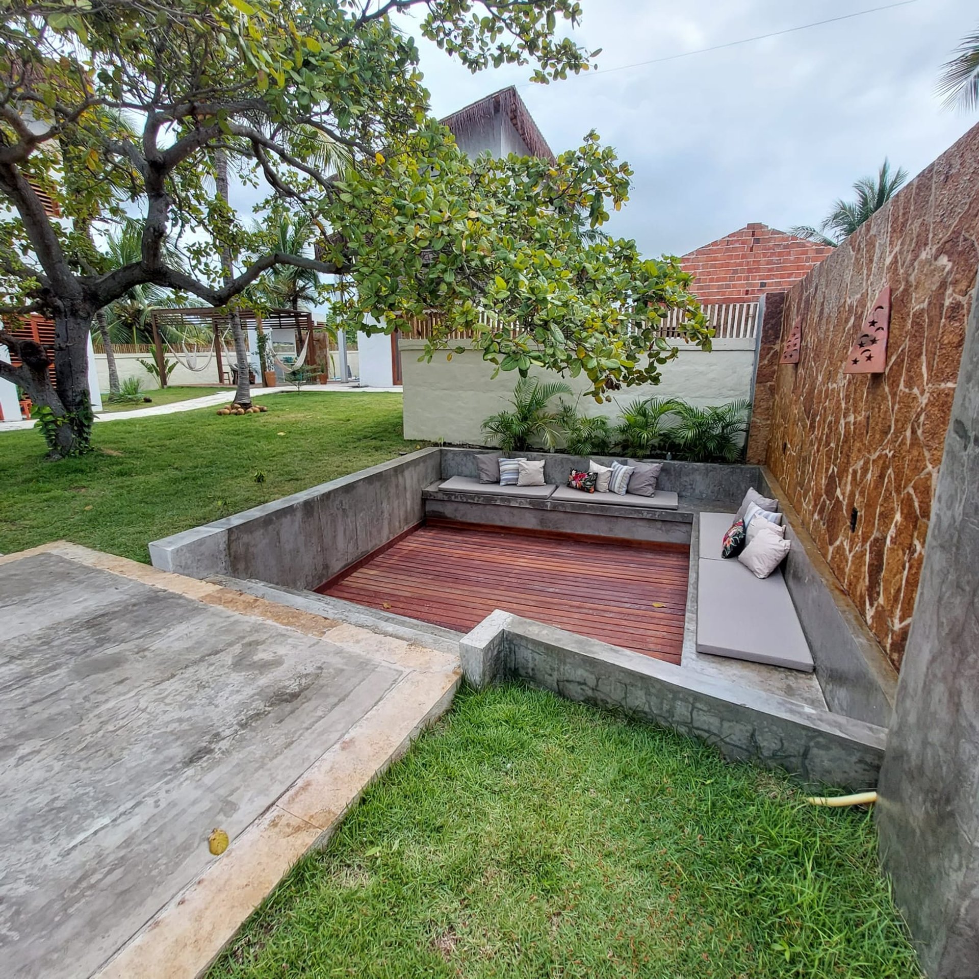 woman wearing yellow long-sleeved dress under white clouds and blue sky during daytime