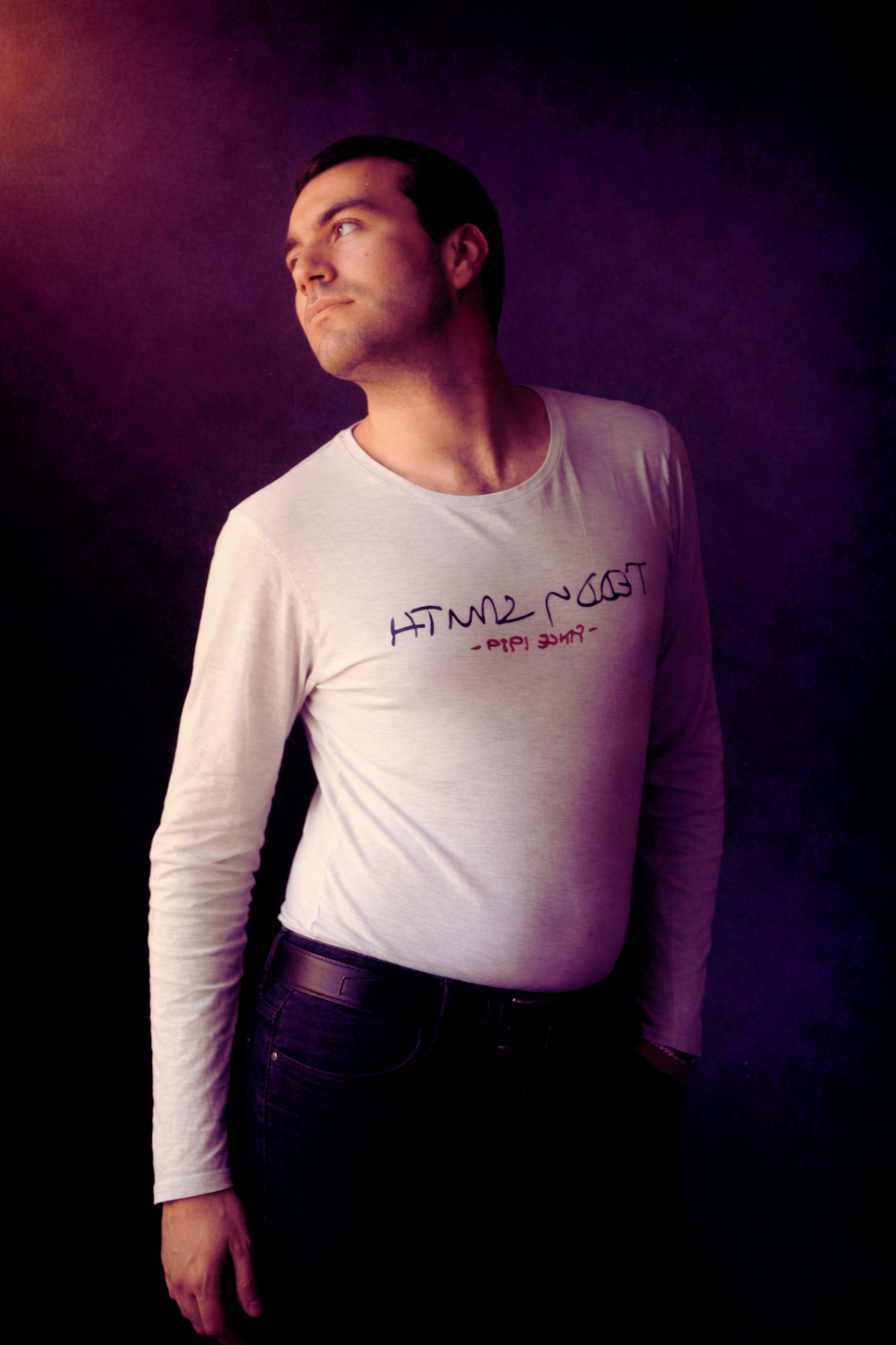 an abstract photo of a curved building with a blue sky in the background