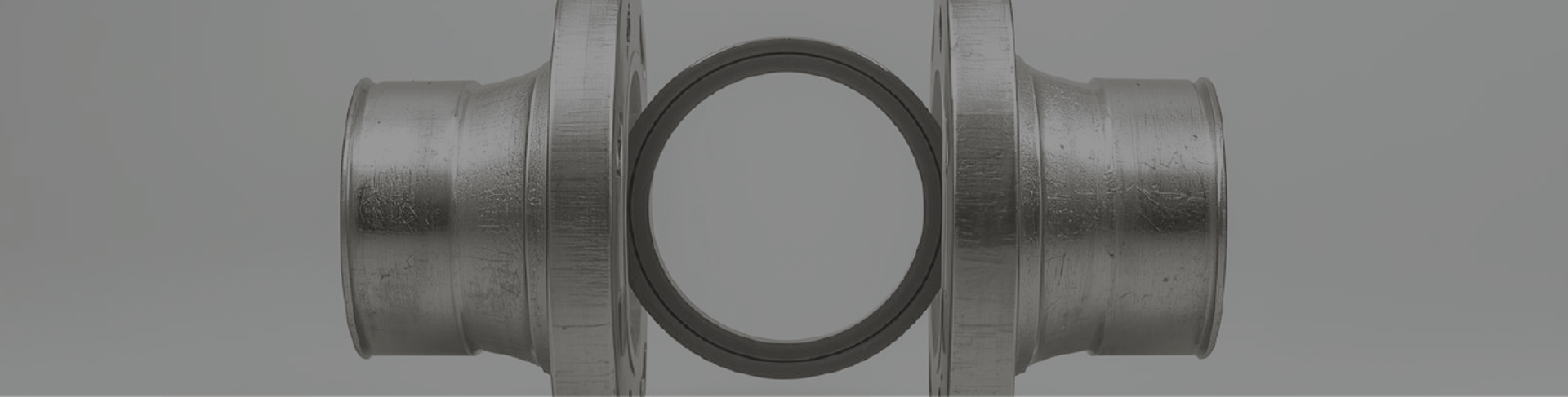 an abstract photo of a curved building with a blue sky in the background