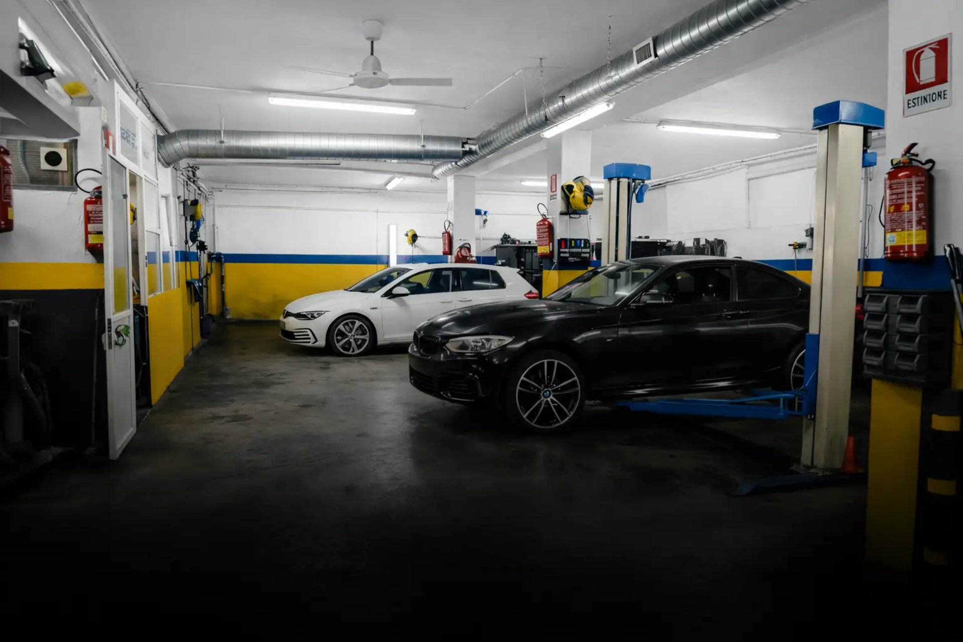 a black car is shown in the dark