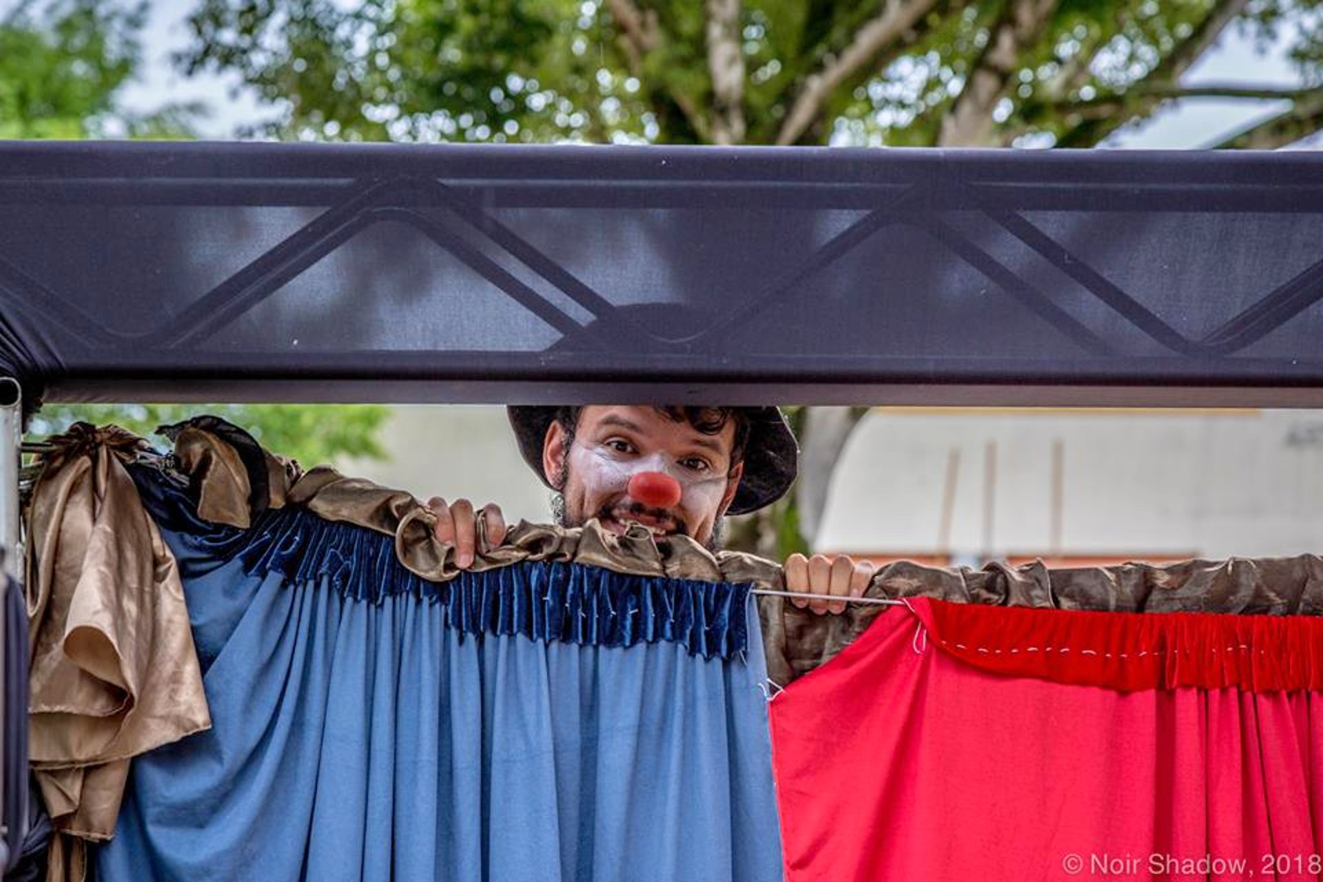 an abstract photo of a curved building with a blue sky in the background