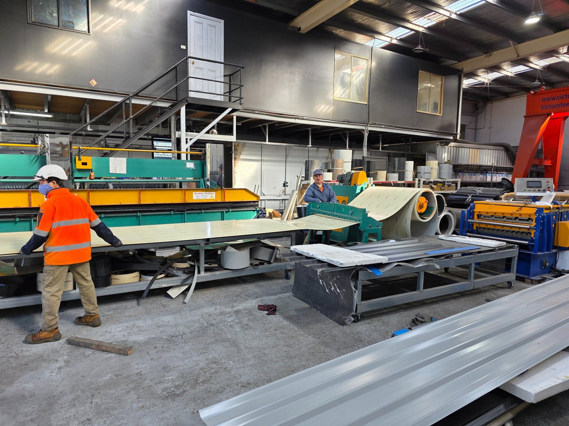 an abstract photo of a curved building with a blue sky in the background