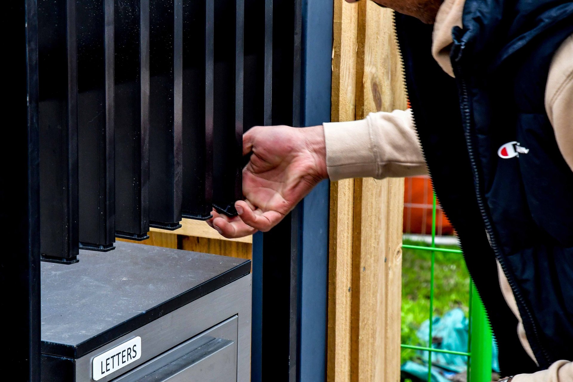 an abstract photo of a curved building with a blue sky in the background