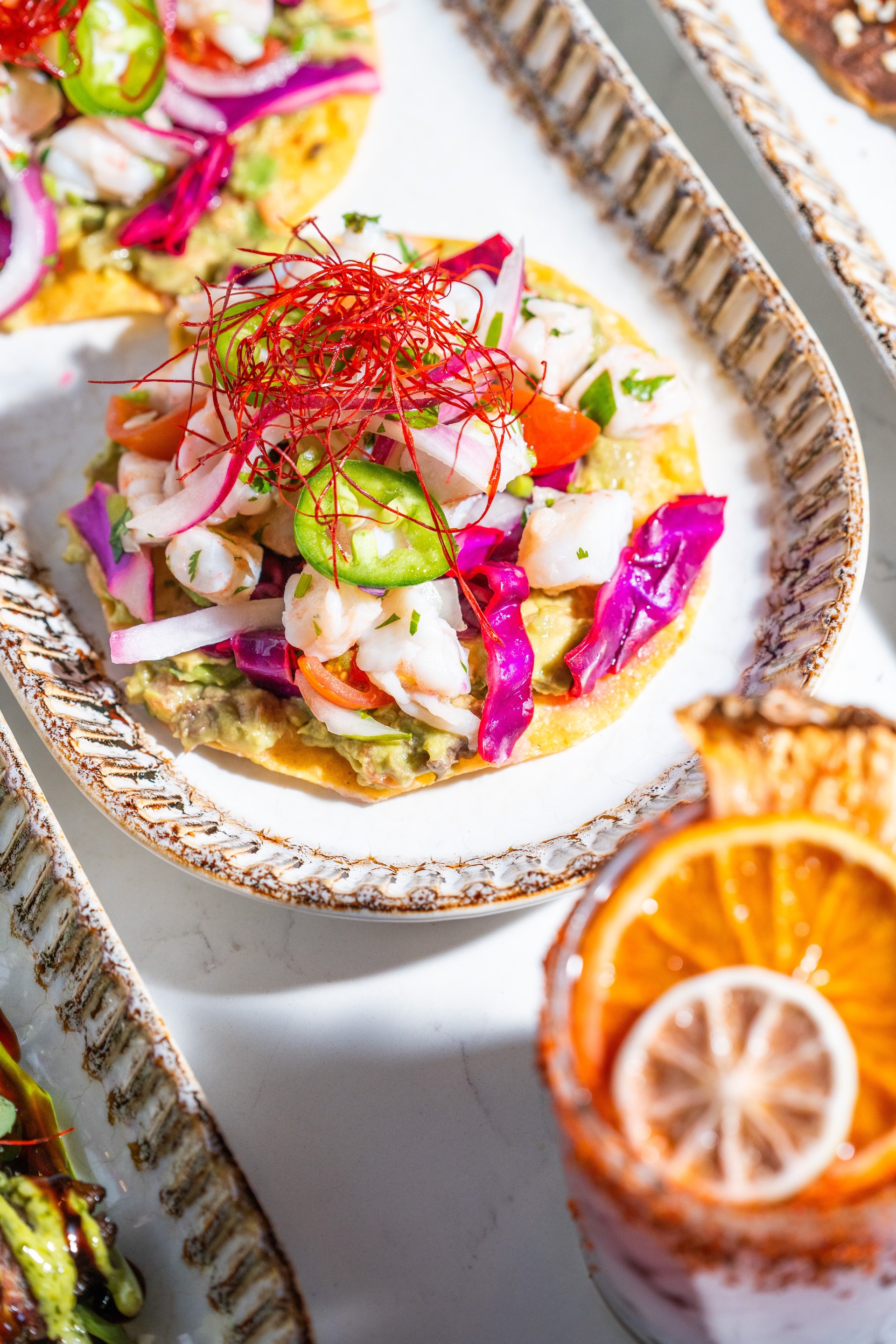 woman wearing yellow long-sleeved dress under white clouds and blue sky during daytime