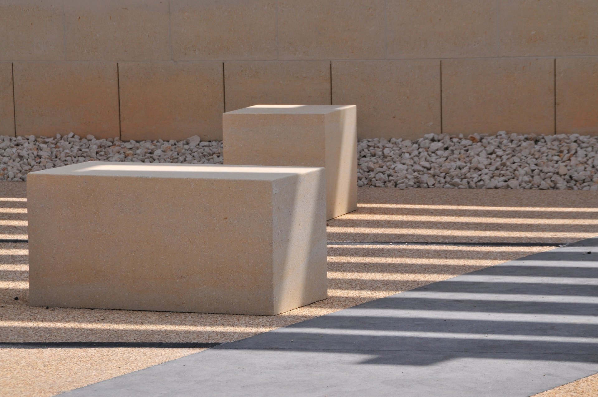 an abstract photo of a curved building with a blue sky in the background