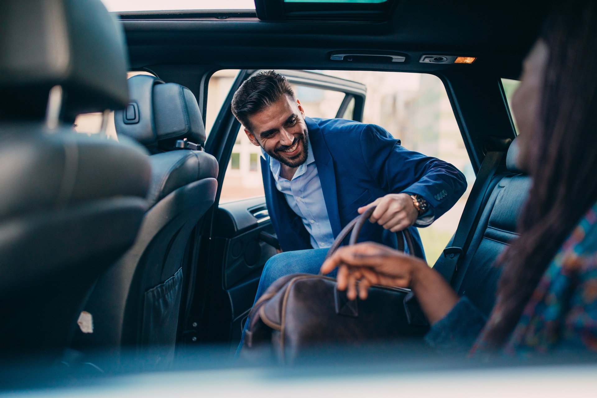 black and brown leather padded tub sofa