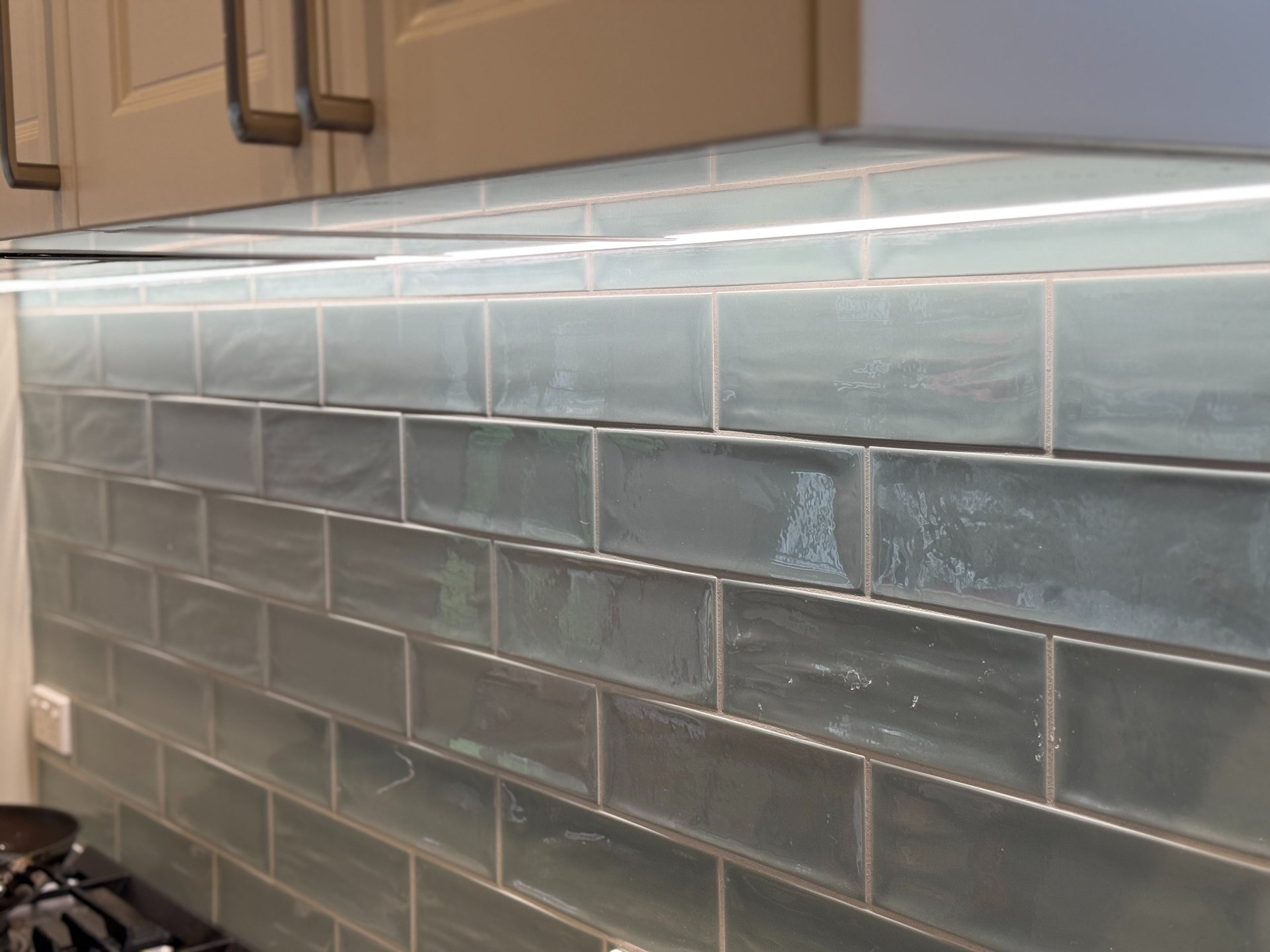 A man sanding a wooden table with a sander