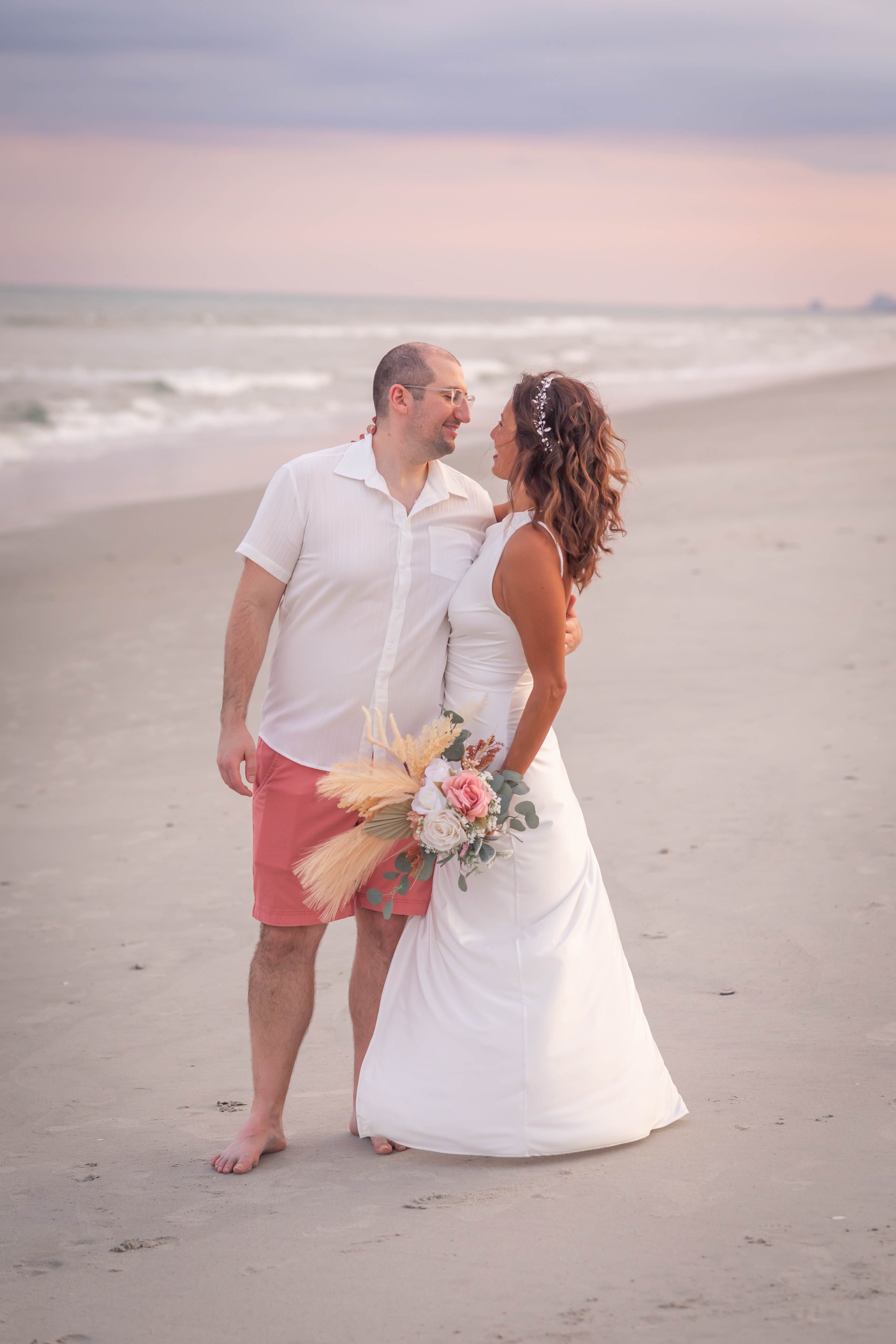 couple wearing silver-colored rings