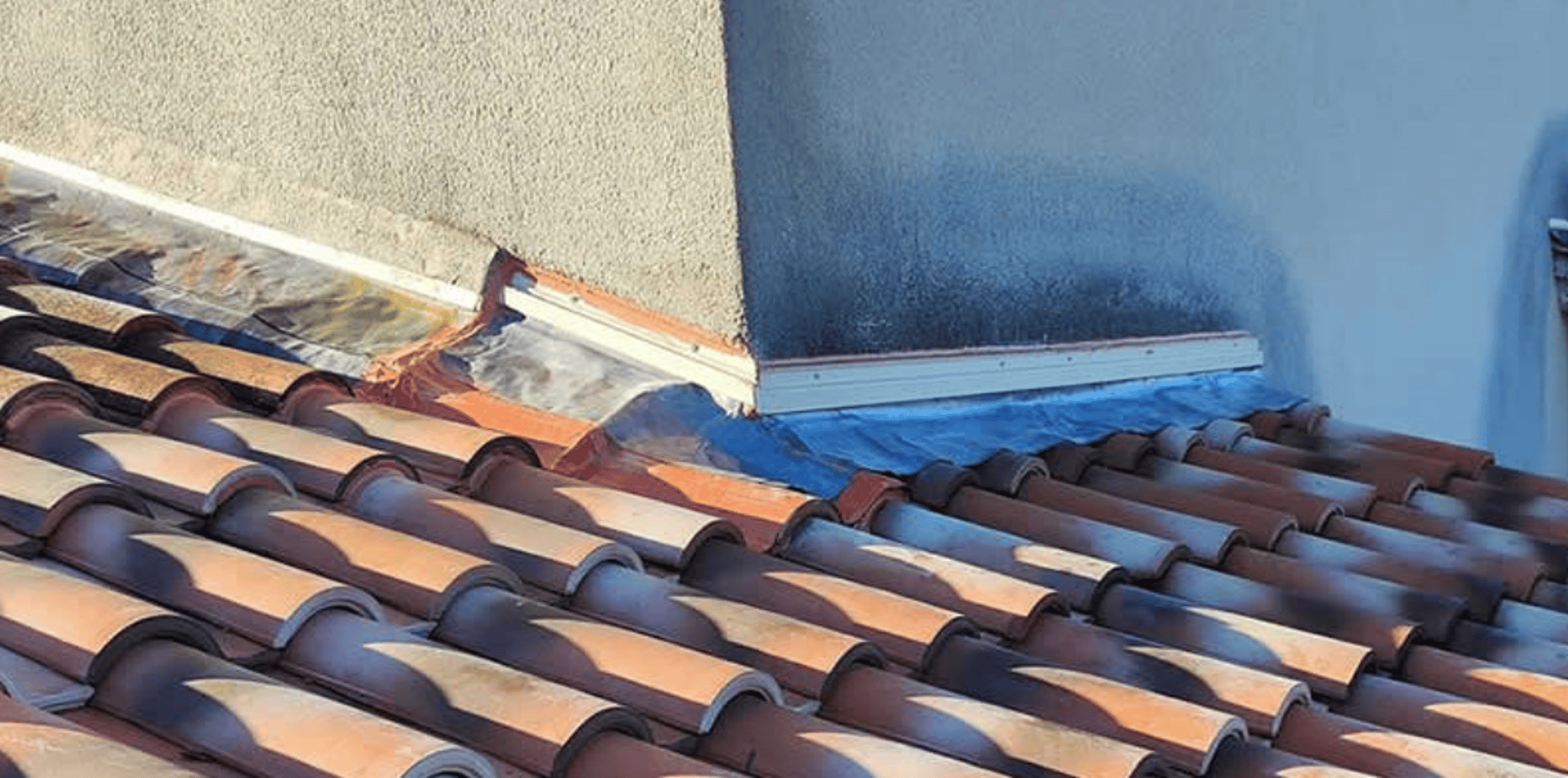 an abstract photo of a curved building with a blue sky in the background
