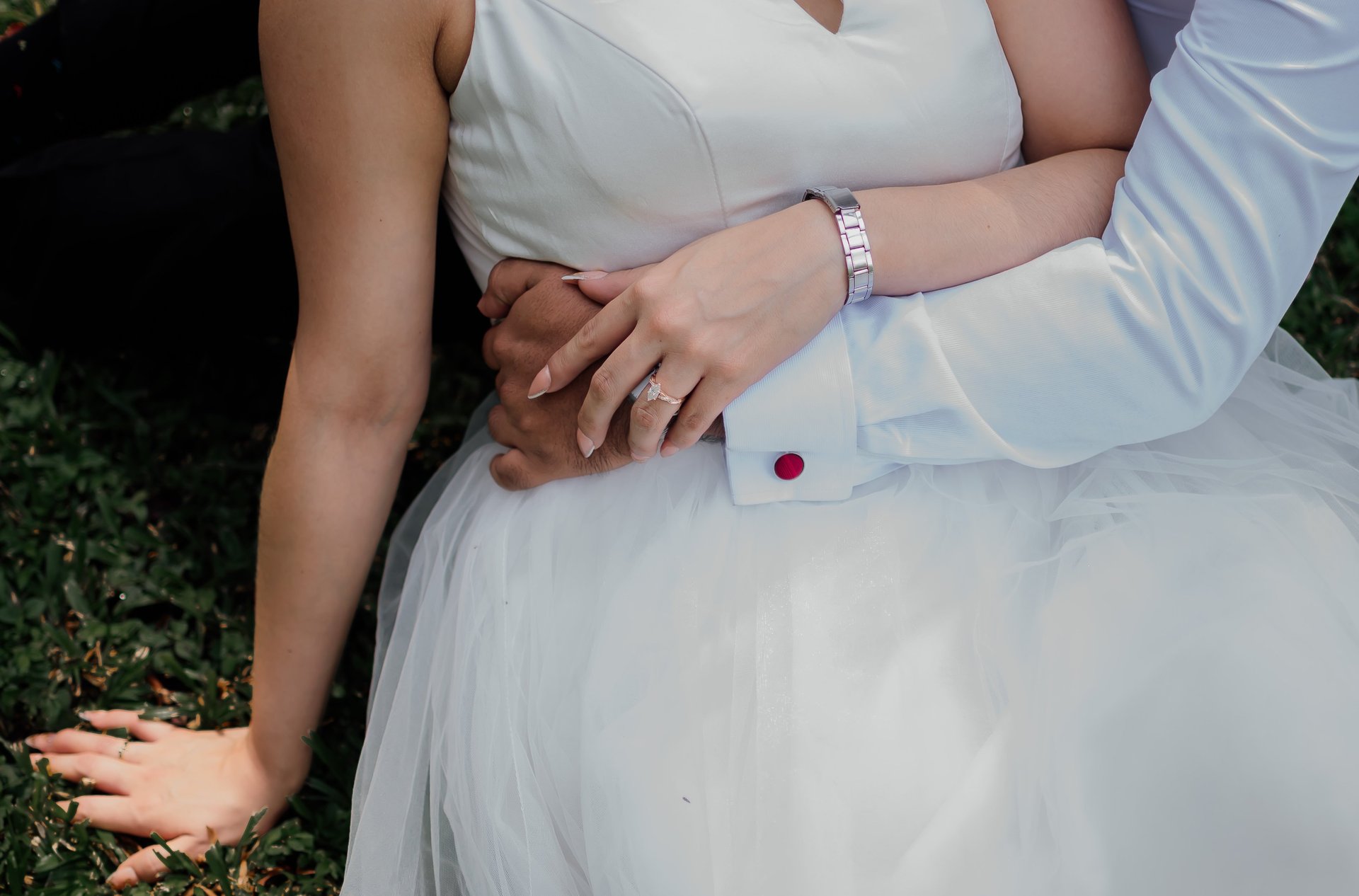 couple wearing silver-colored rings
