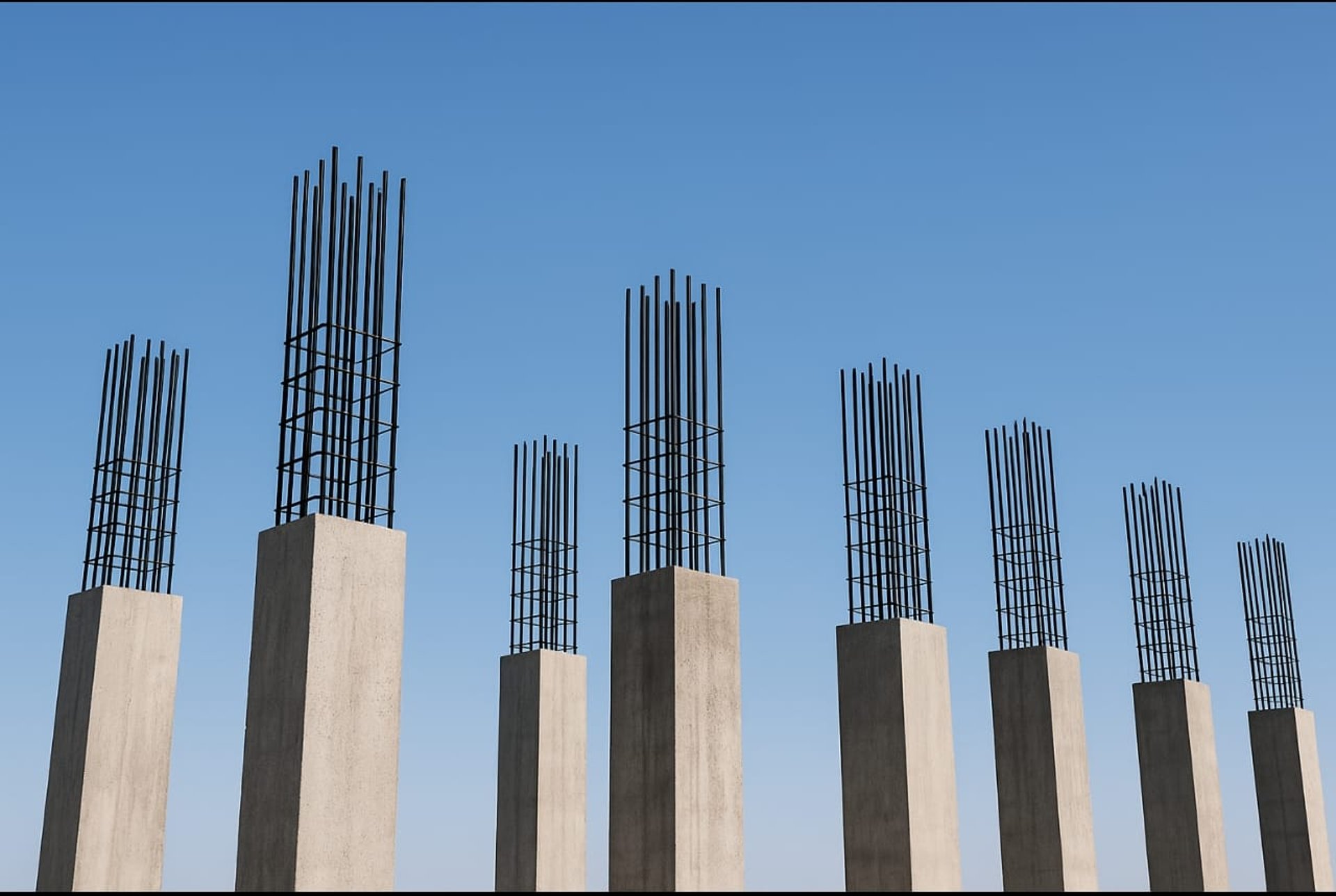 low angle photography of gray tower crane