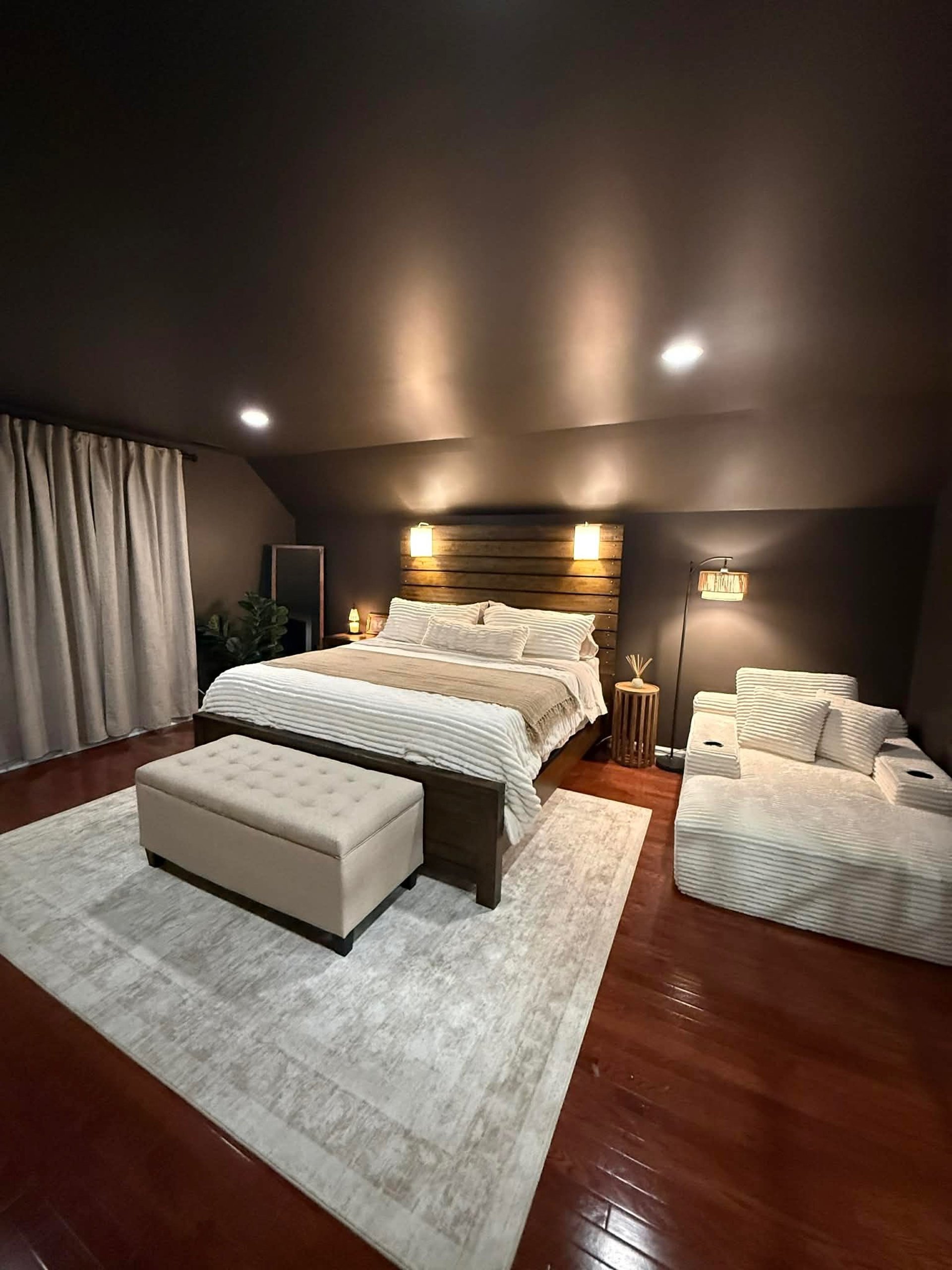 a large white house with two garages on the front of it