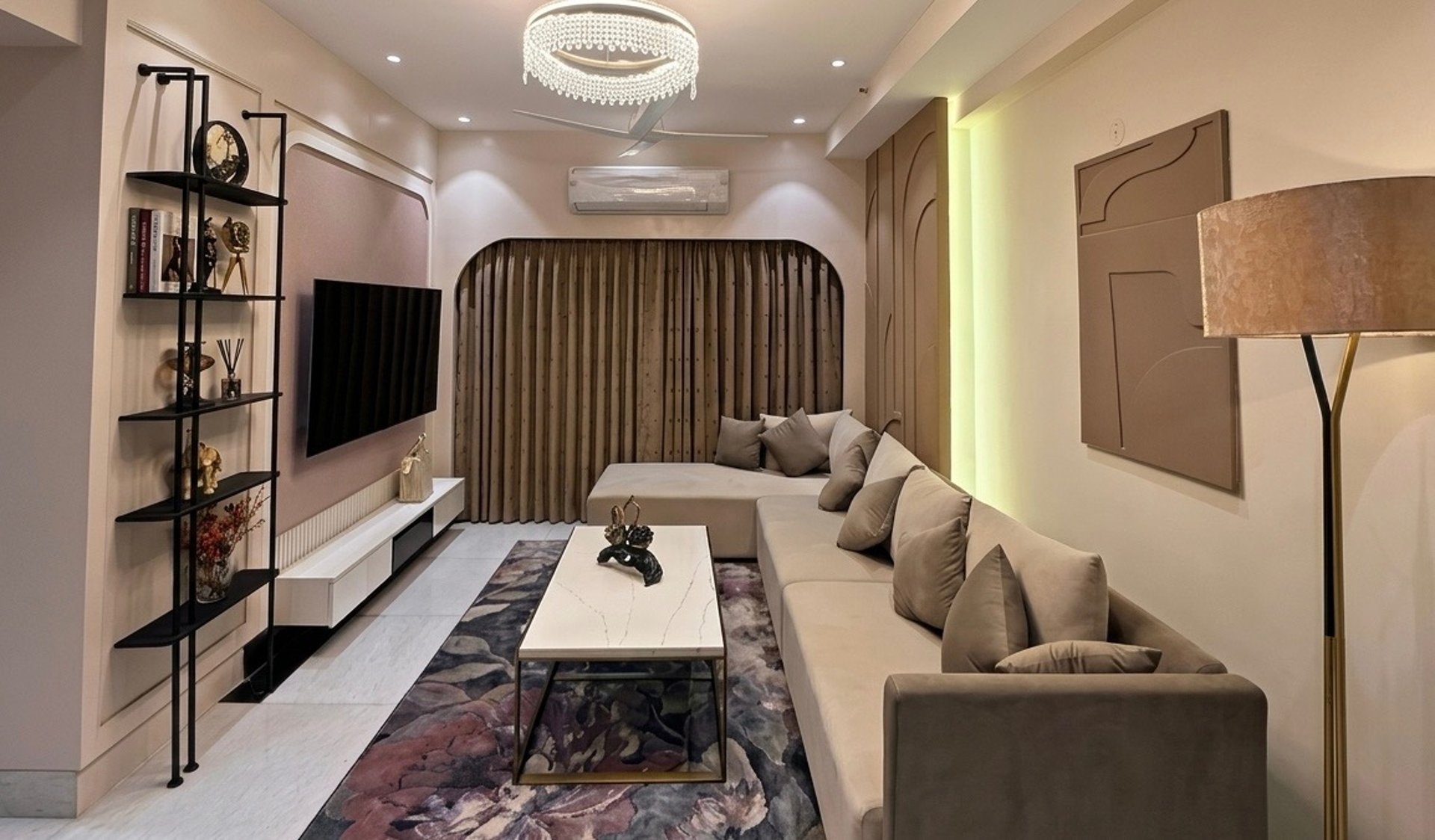 Modern living room with white sofa and wooden chairs.