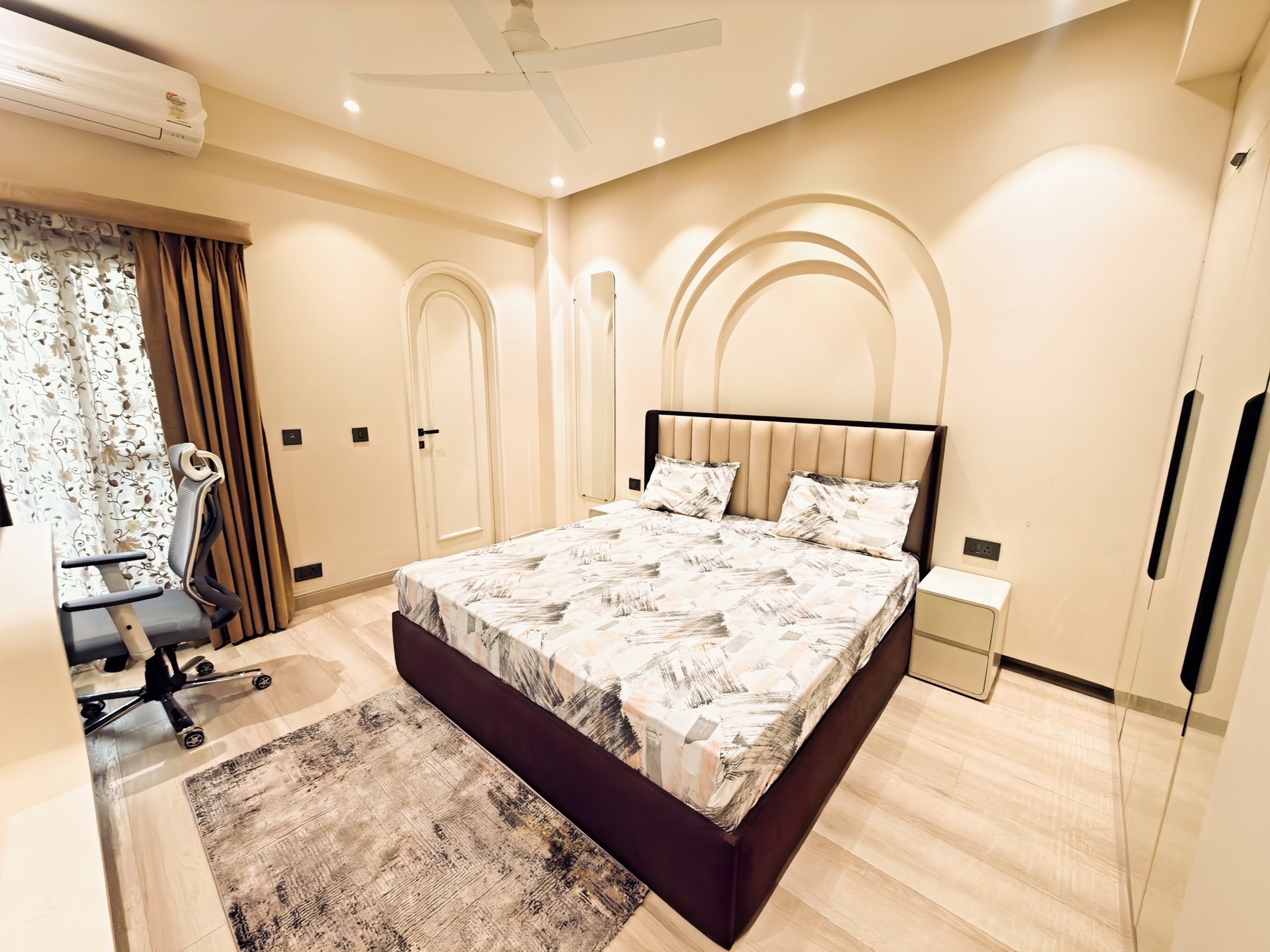 an abstract photo of a curved building with a blue sky in the background