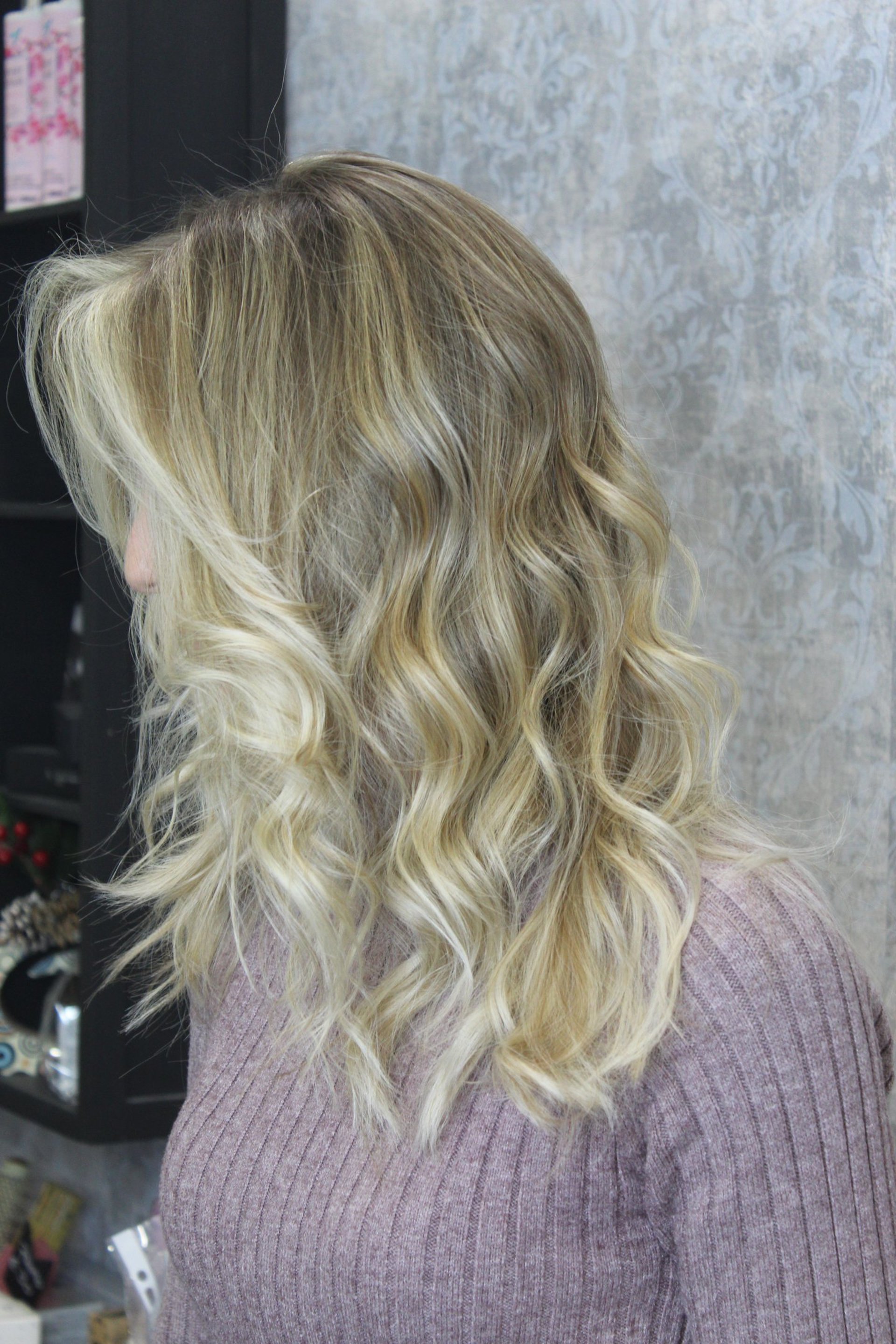 woman wearing yellow long-sleeved dress under white clouds and blue sky during daytime