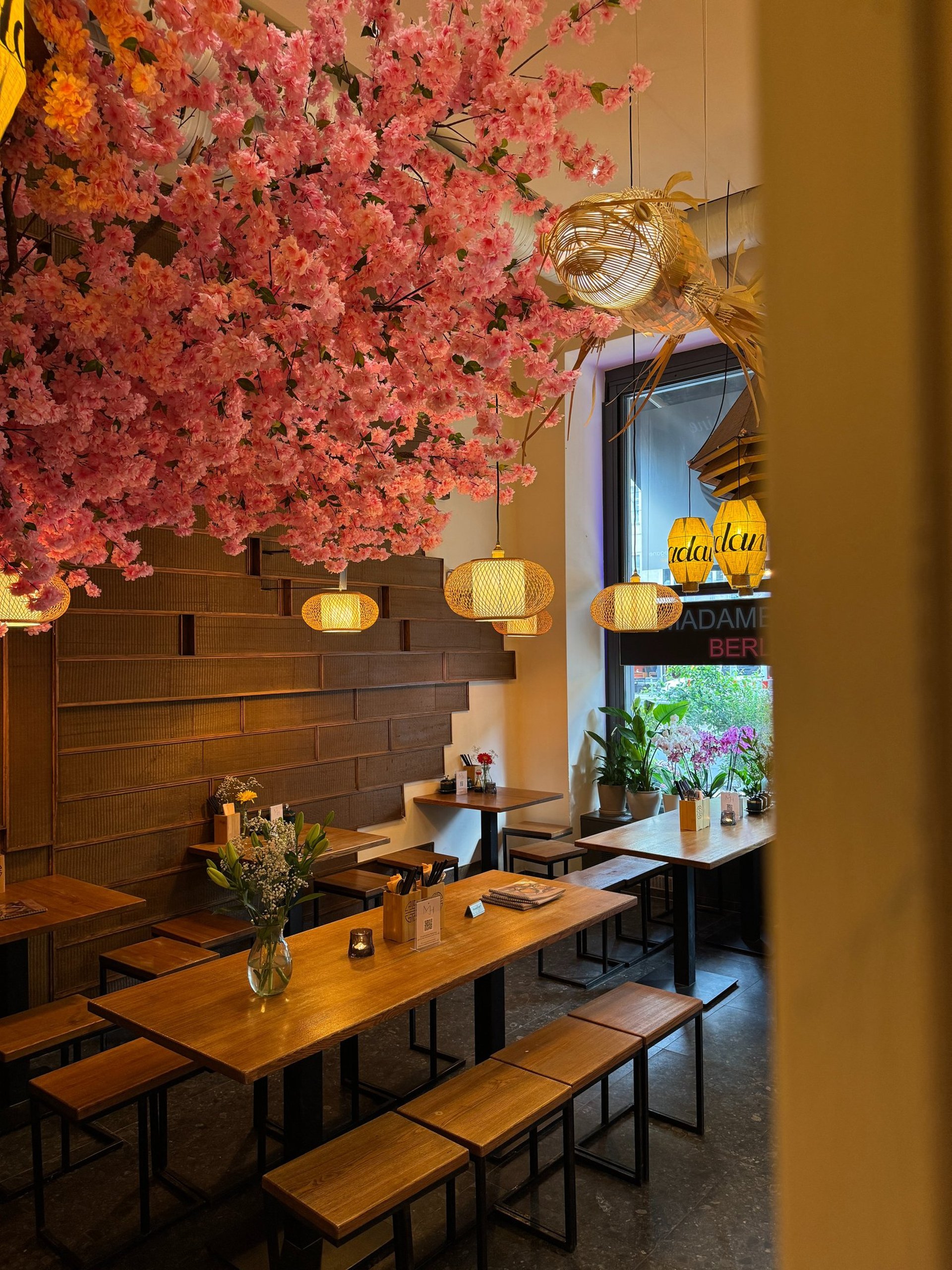 people sitting beside brown wooden table inside room