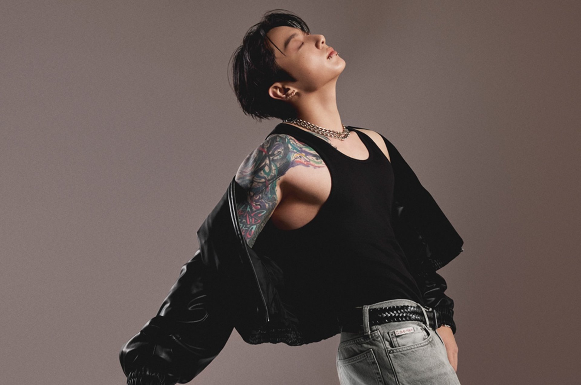 an abstract photo of a curved building with a blue sky in the background