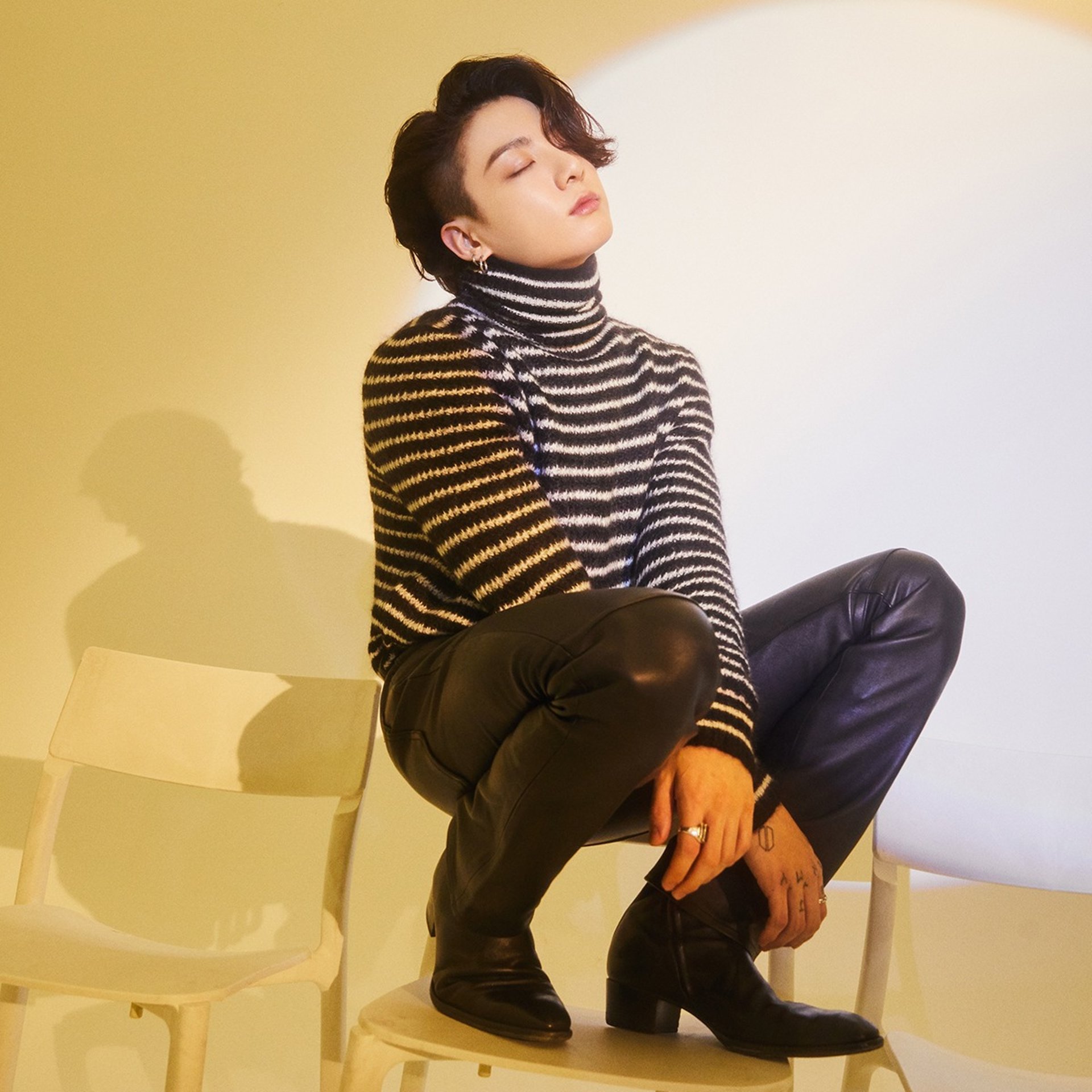 an abstract photo of a curved building with a blue sky in the background