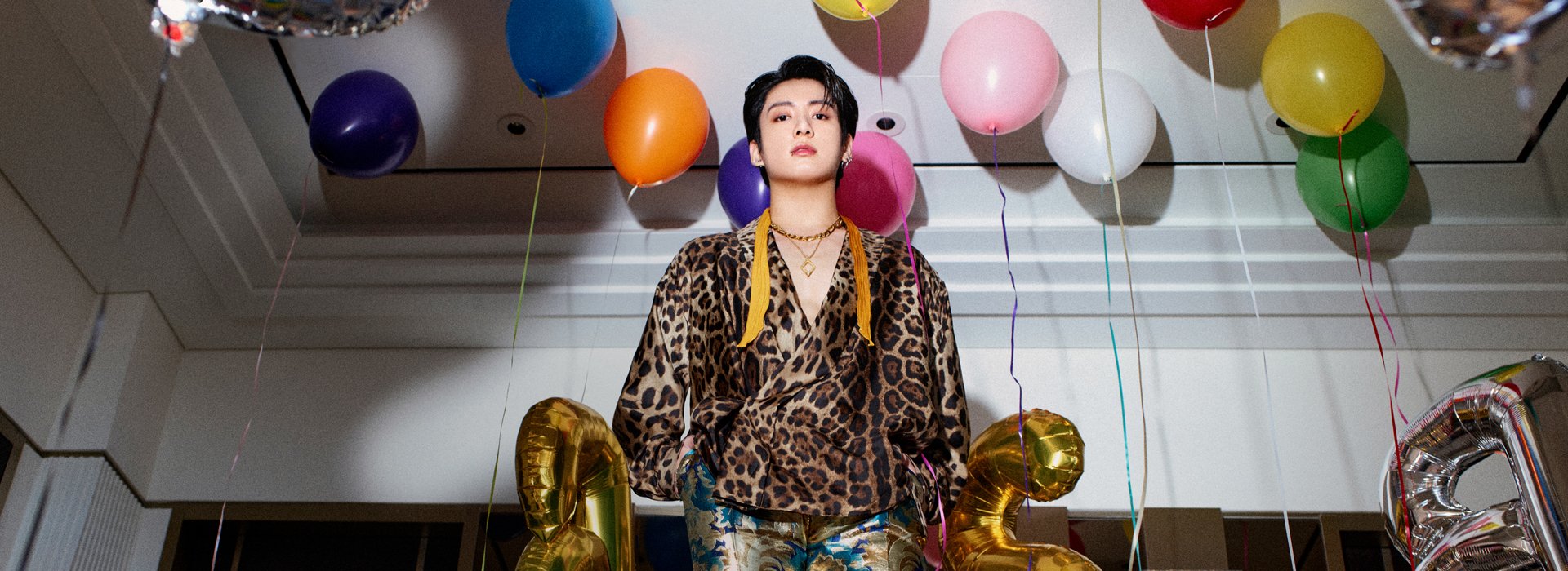 an abstract photo of a curved building with a blue sky in the background