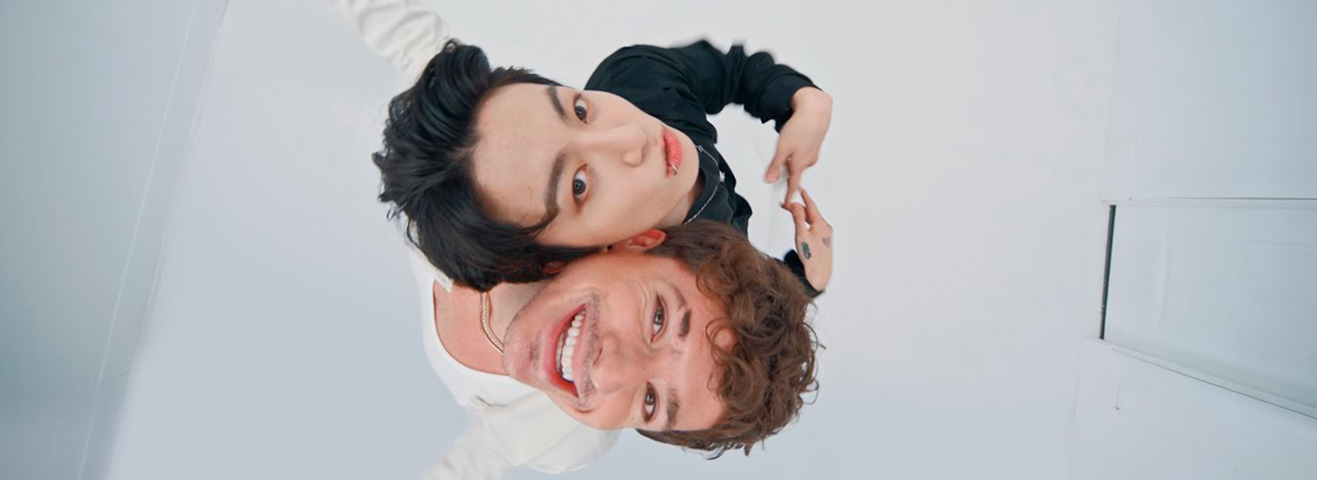 an abstract photo of a curved building with a blue sky in the background