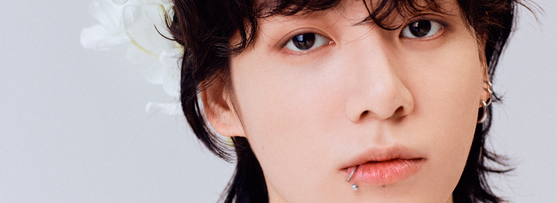 an abstract photo of a curved building with a blue sky in the background