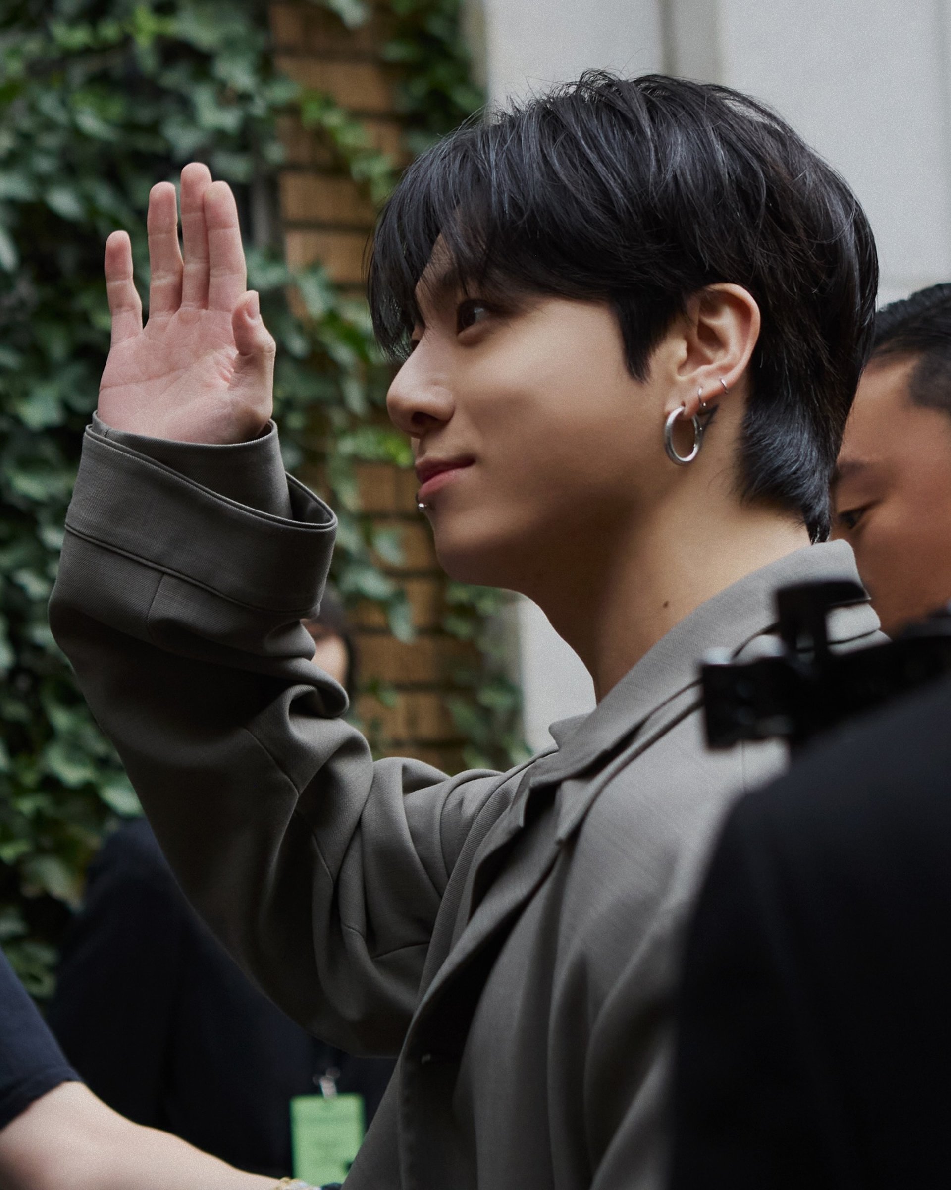 an abstract photo of a curved building with a blue sky in the background