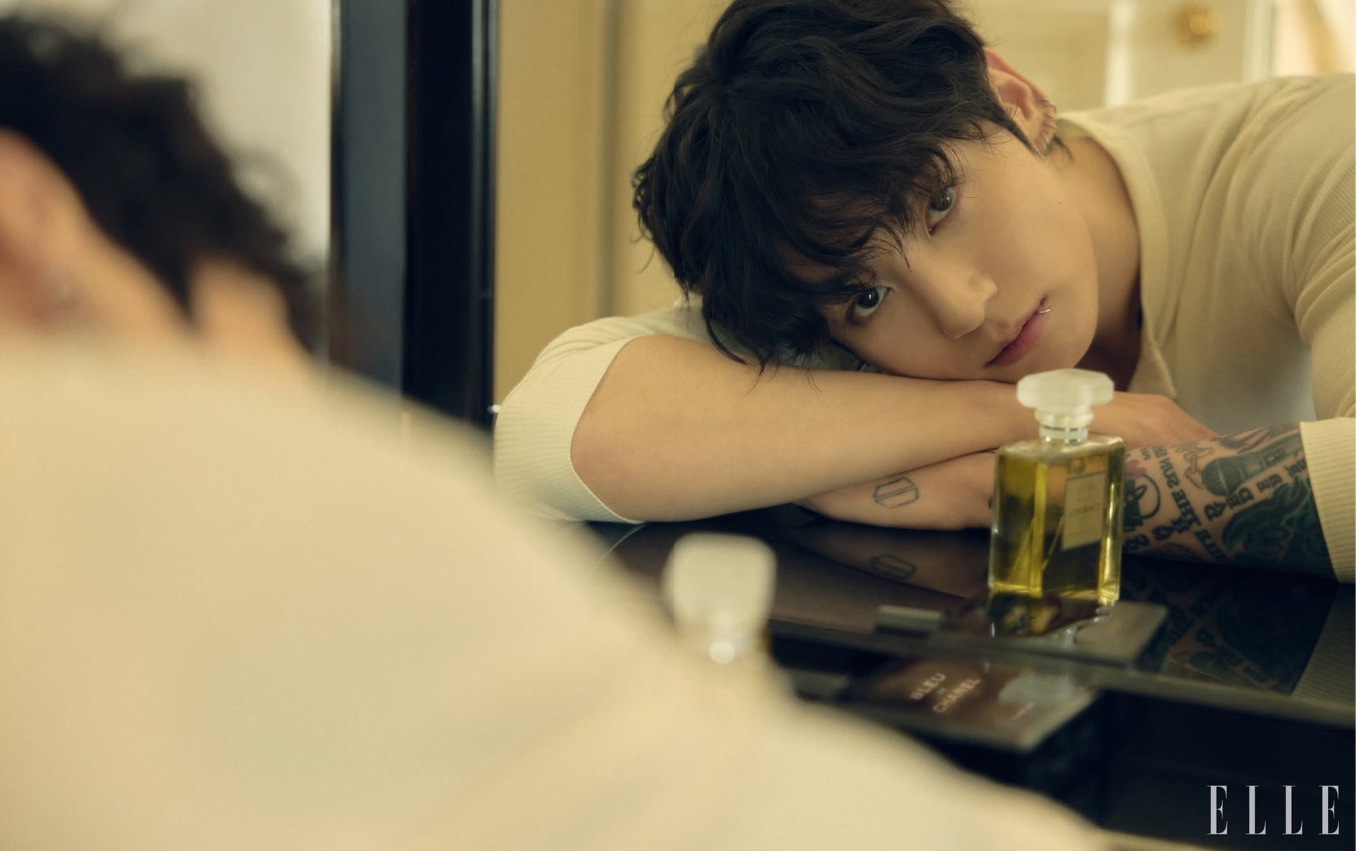 an abstract photo of a curved building with a blue sky in the background