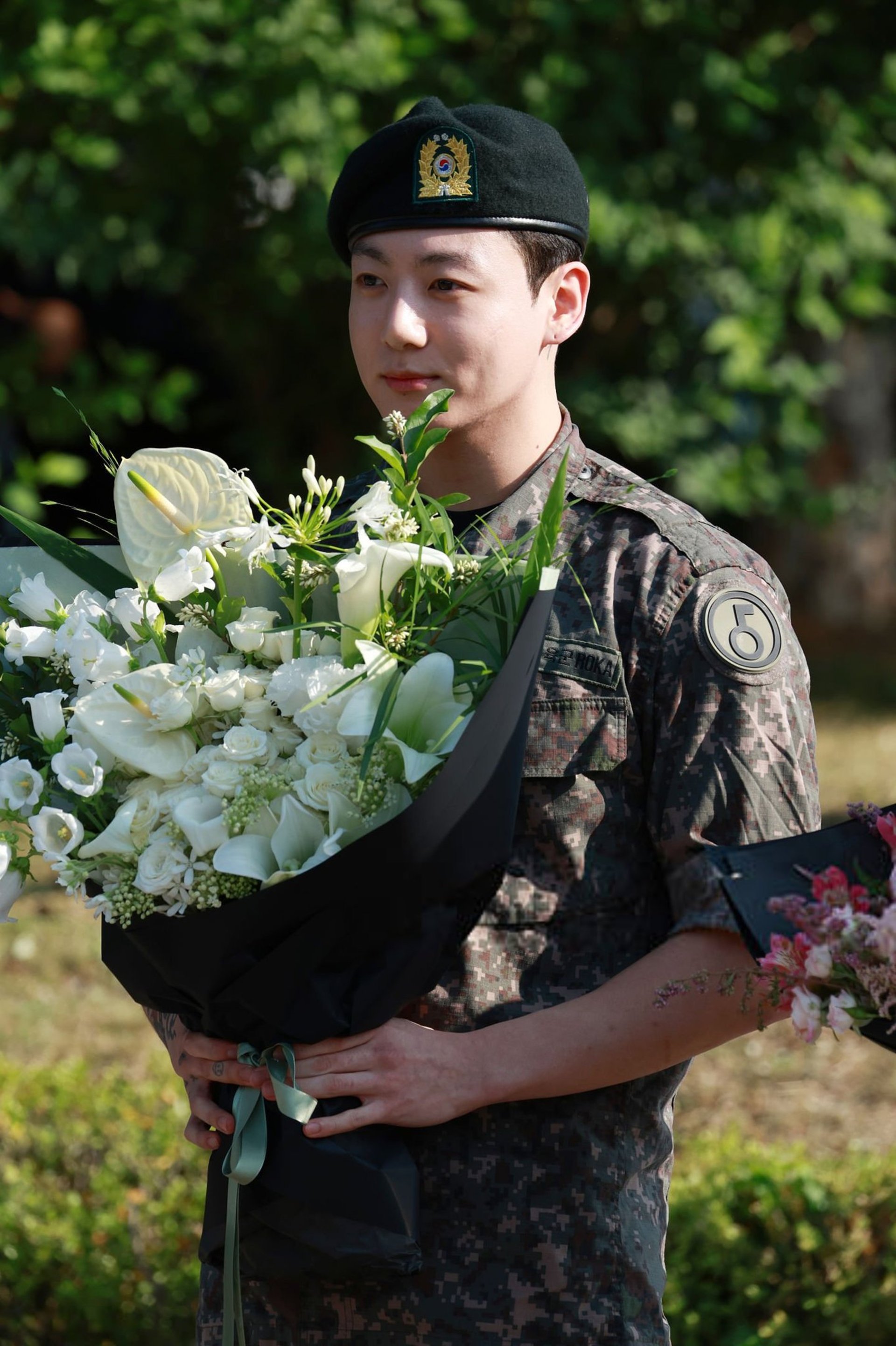 an abstract photo of a curved building with a blue sky in the background
