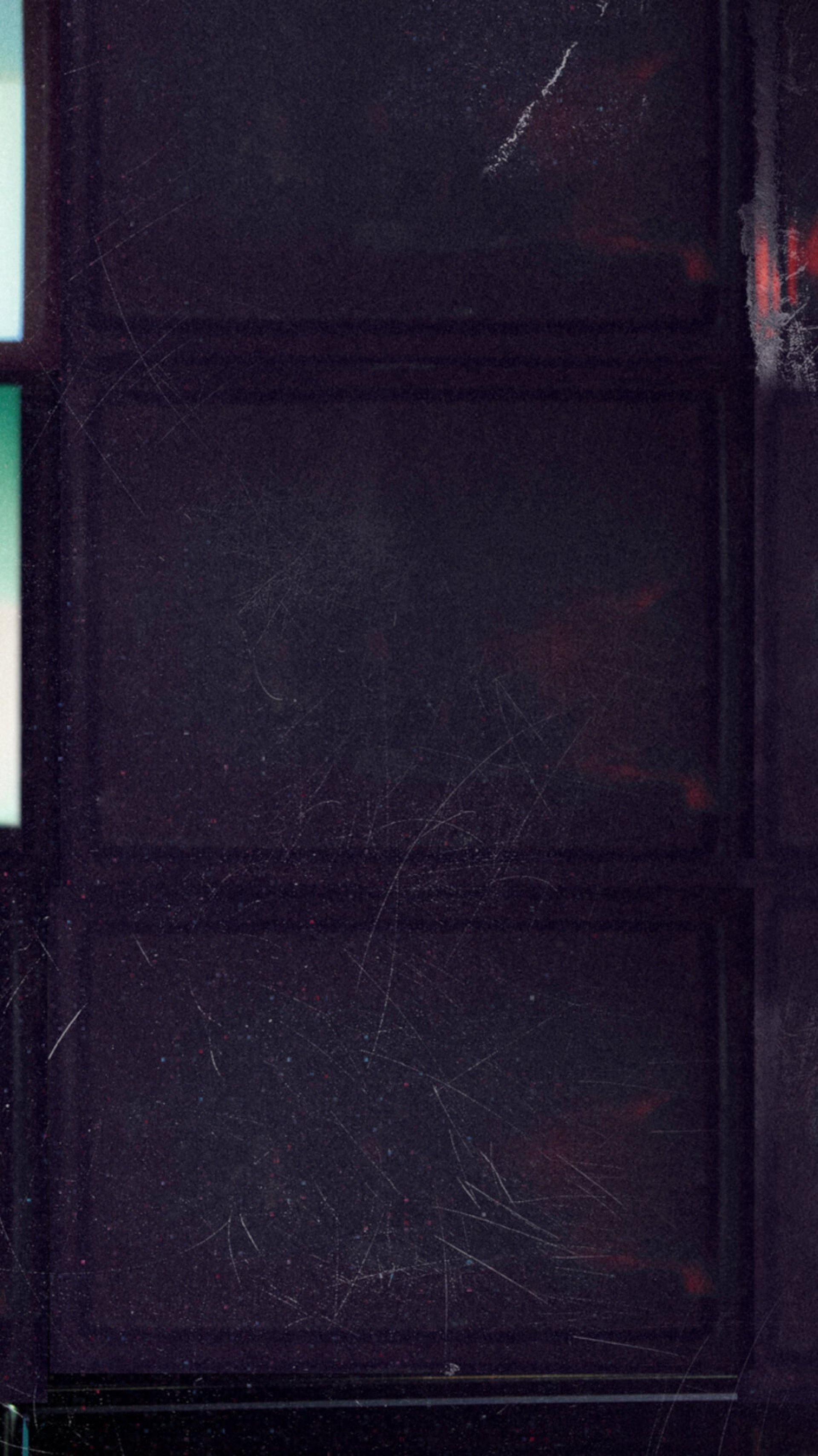 an abstract photo of a curved building with a blue sky in the background