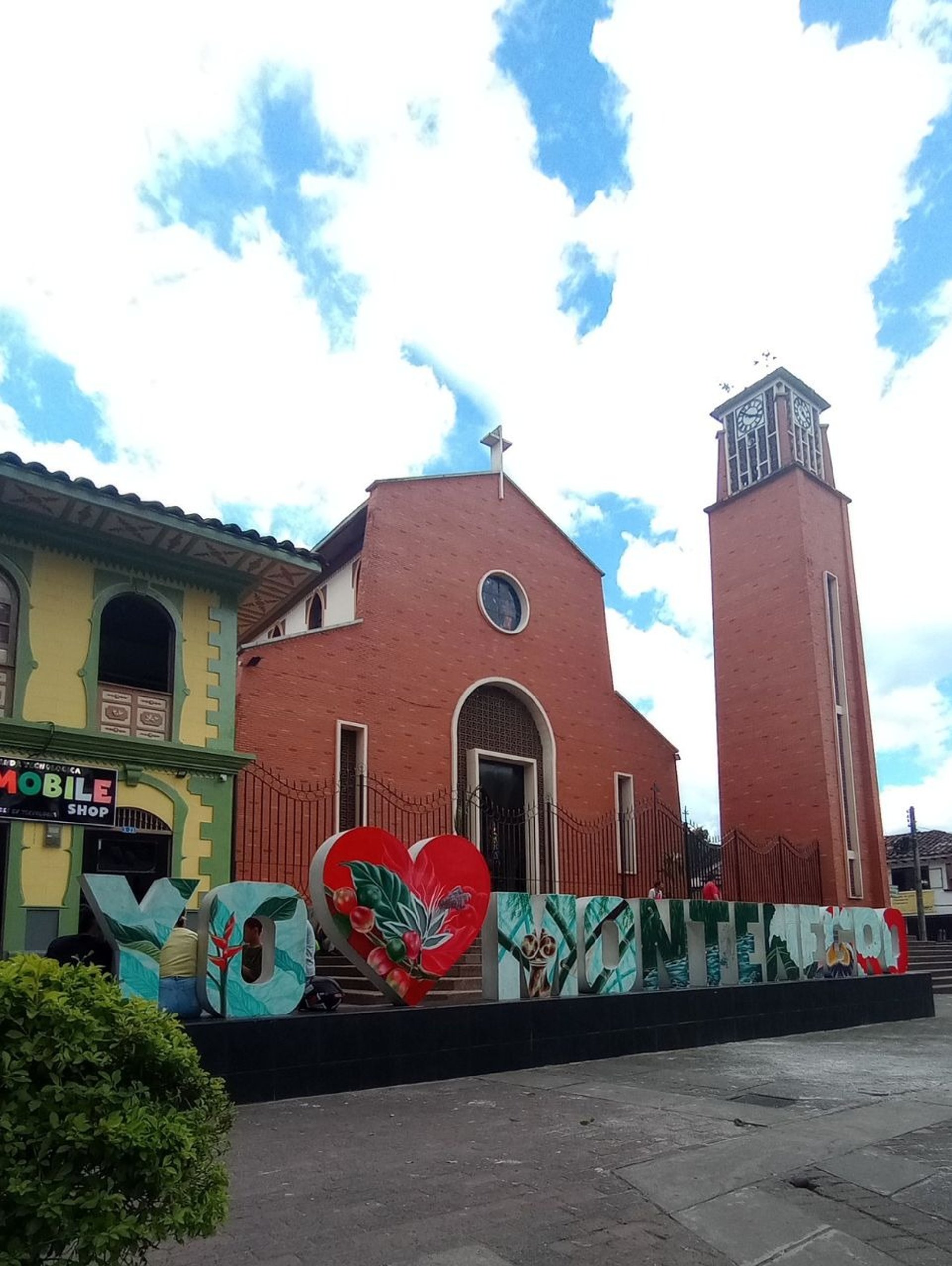 woman wearing yellow long-sleeved dress under white clouds and blue sky during daytime