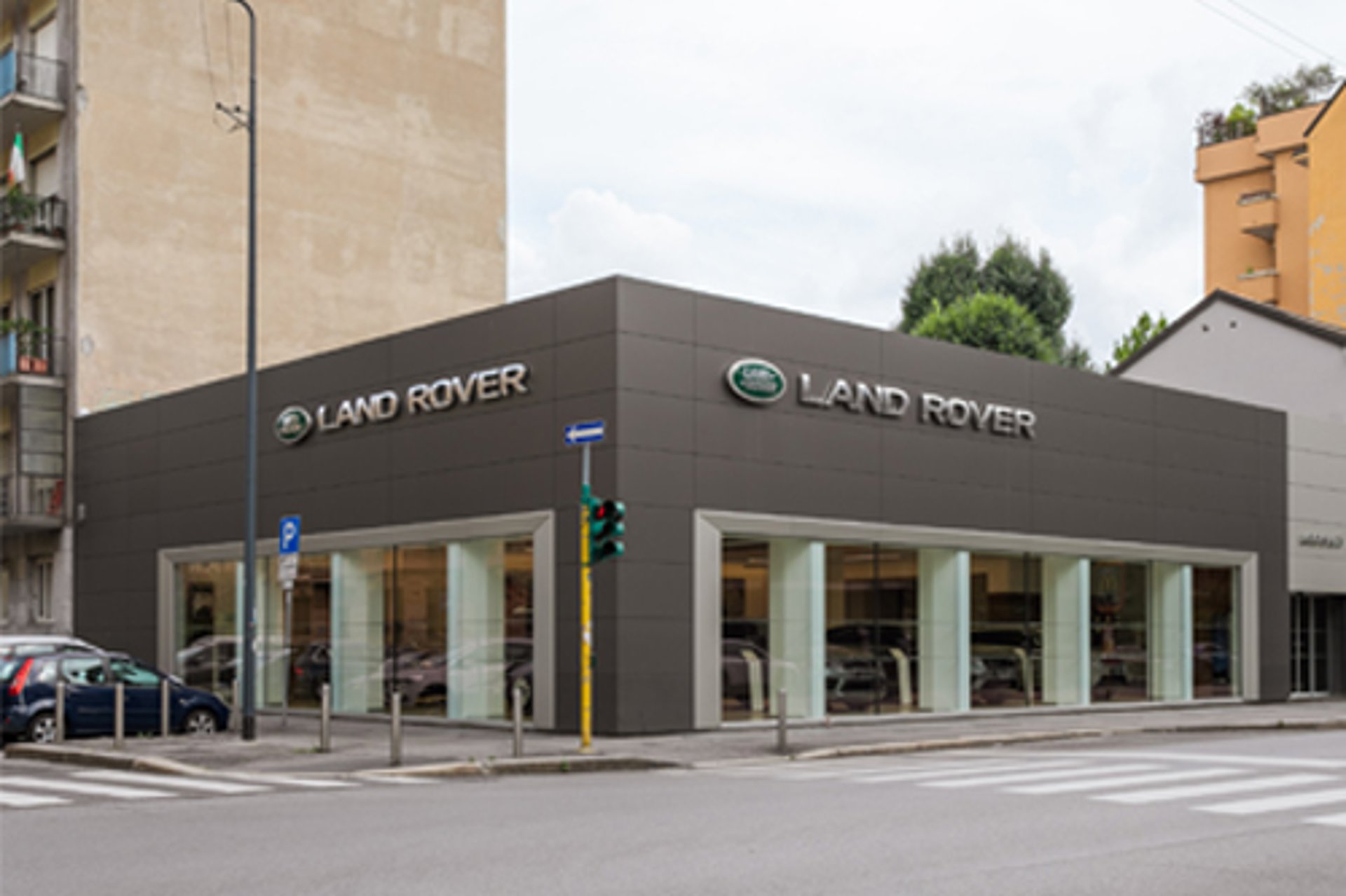 an abstract photo of a curved building with a blue sky in the background
