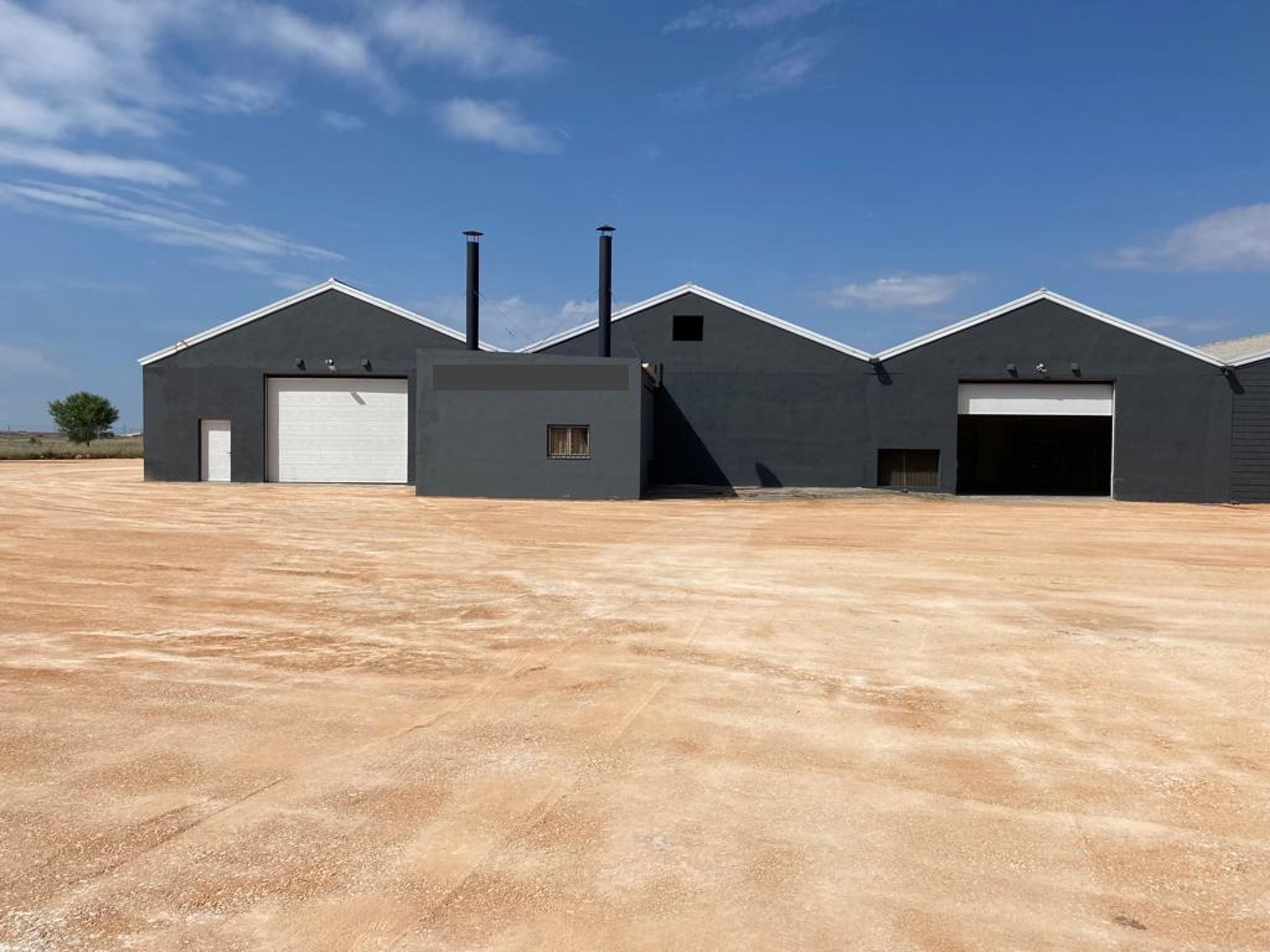 woman wearing yellow long-sleeved dress under white clouds and blue sky during daytime