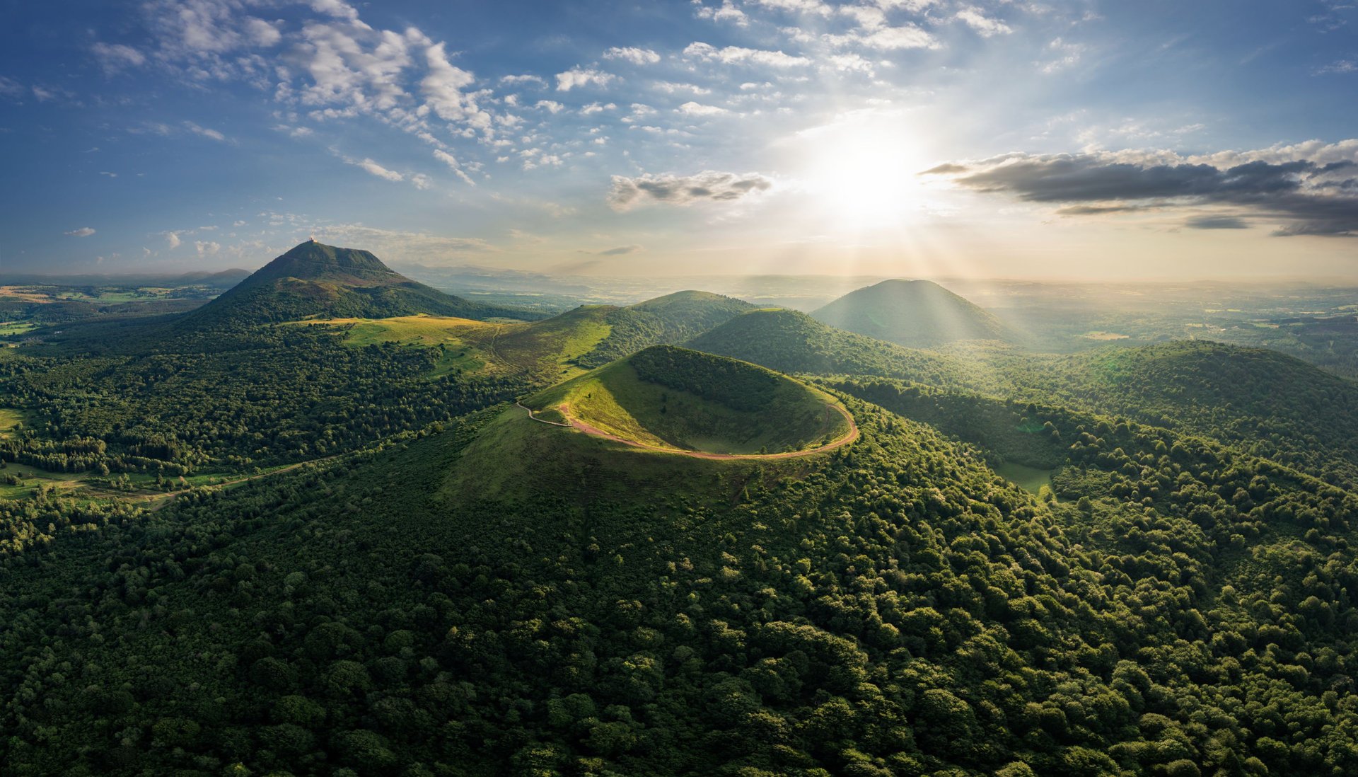 an abstract photo of a curved building with a blue sky in the background