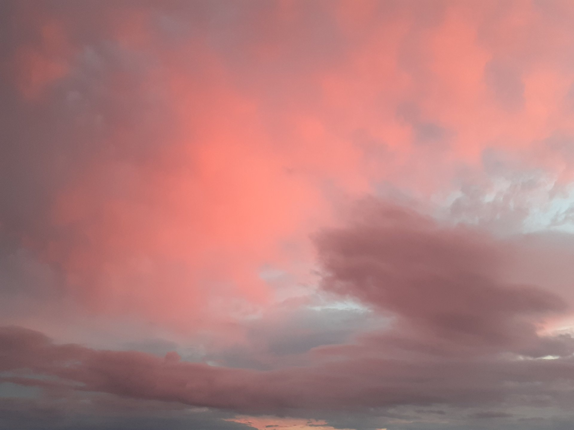 sea under white clouds at golden hour