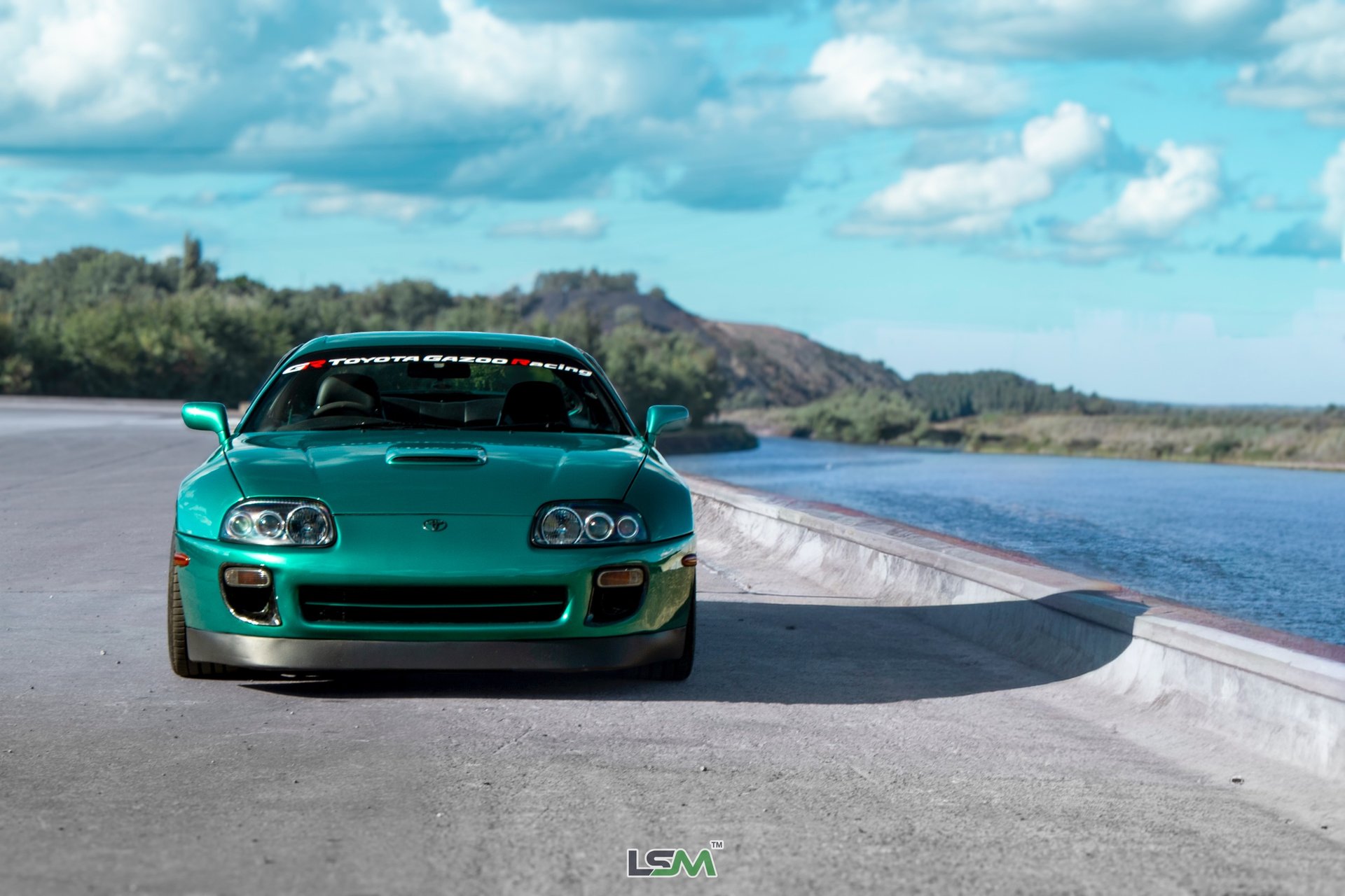 an abstract photo of a curved building with a blue sky in the background