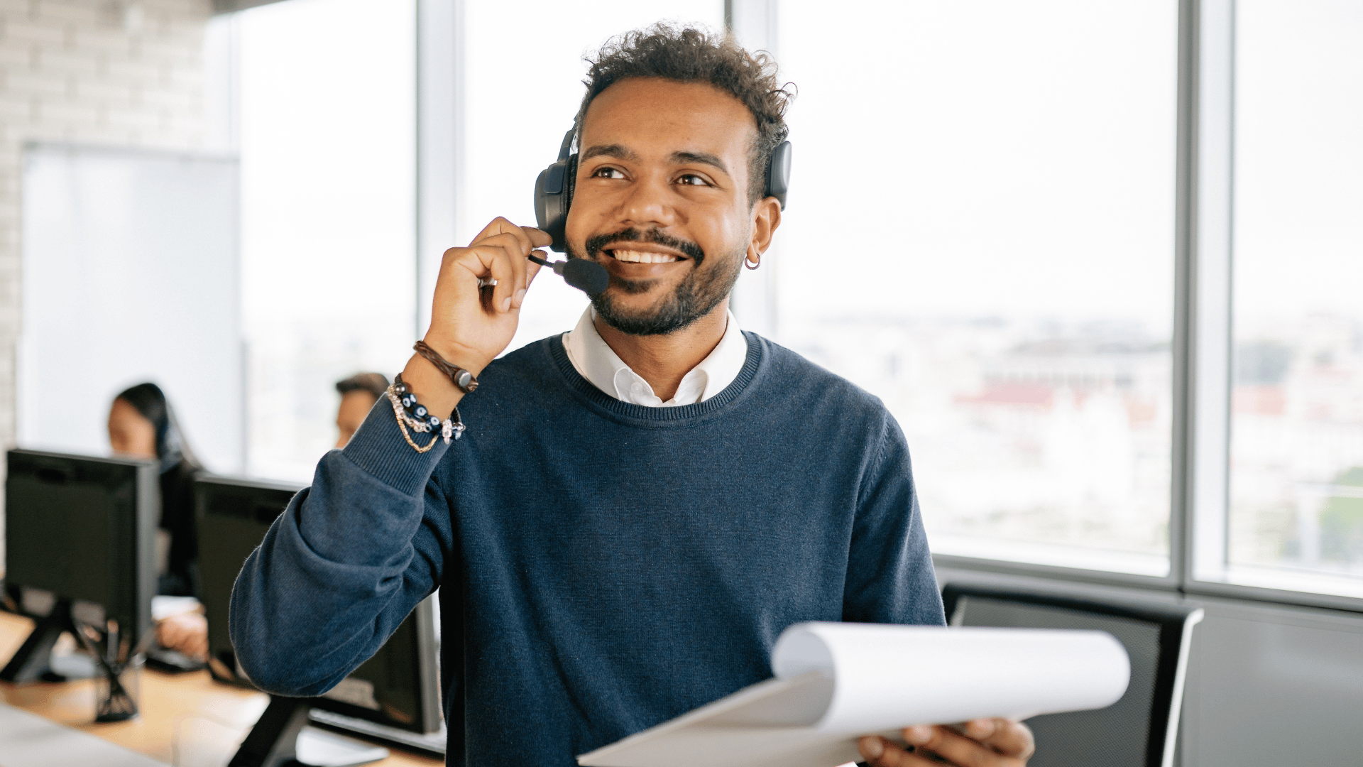 an abstract photo of a curved building with a blue sky in the background