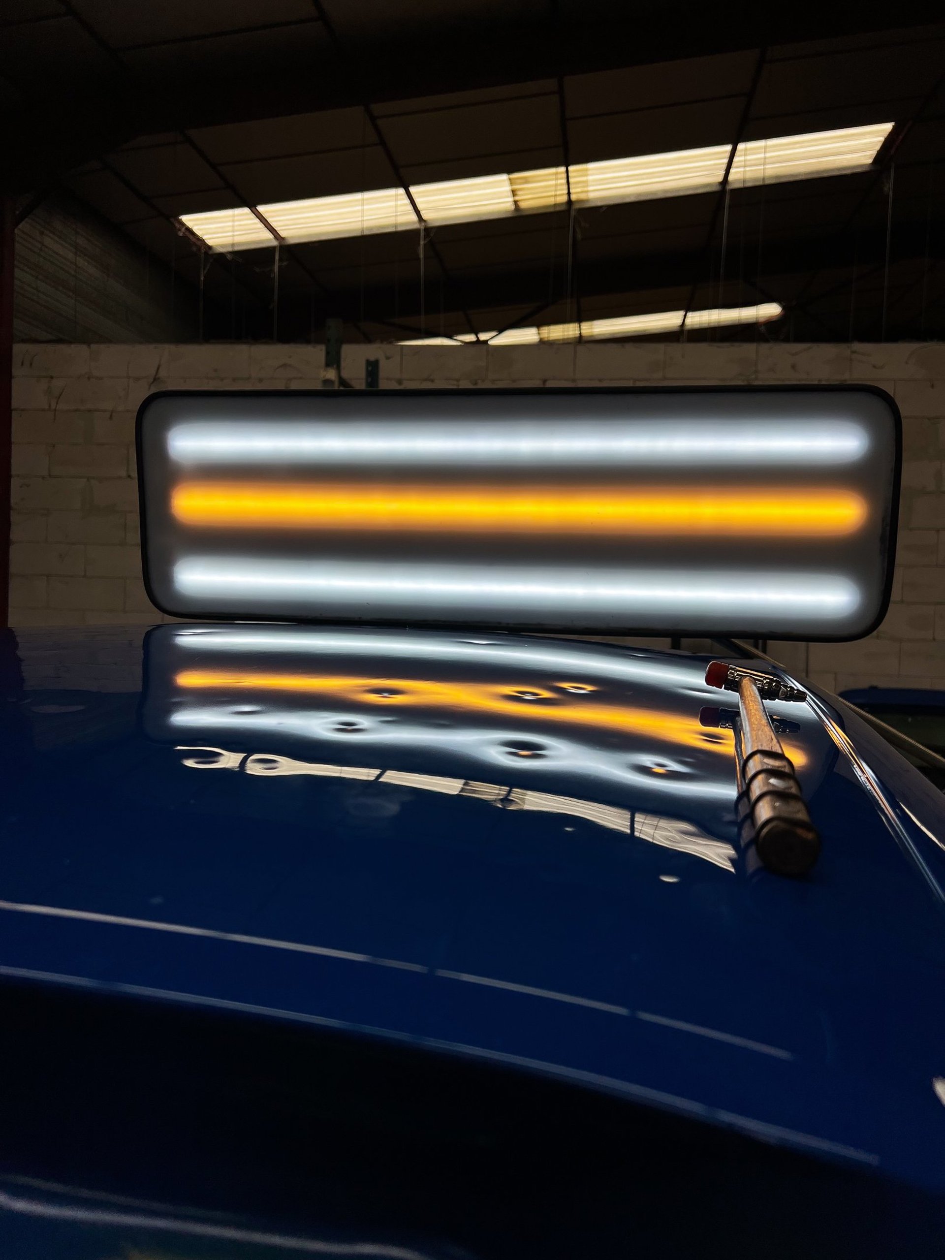 an abstract photo of a curved building with a blue sky in the background