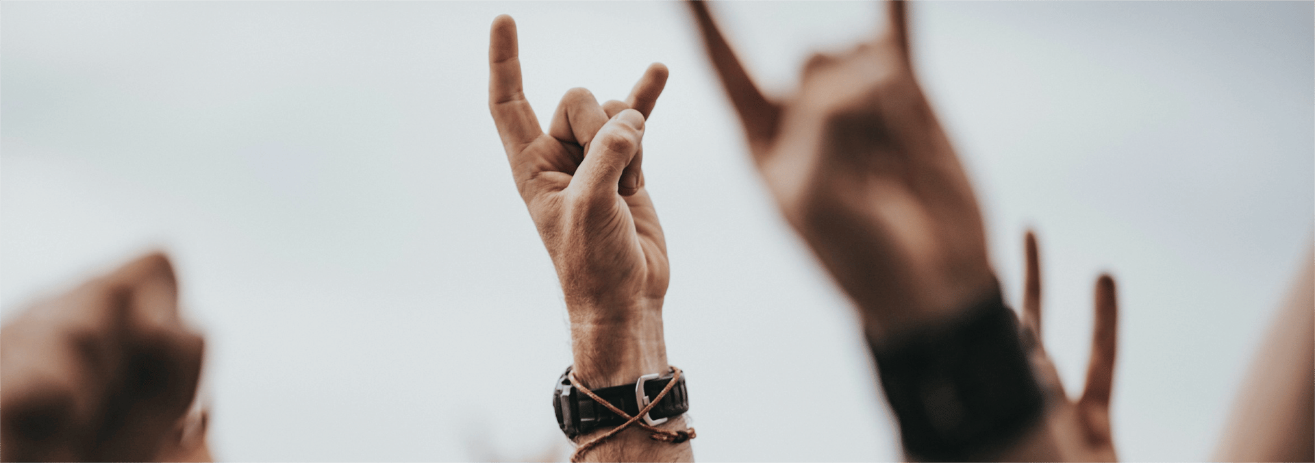 sign of the horns close up photography