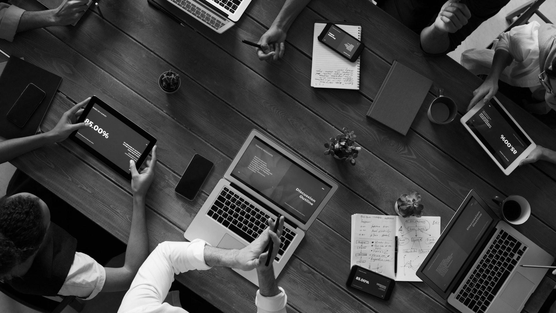 silver iMac turned on at the table