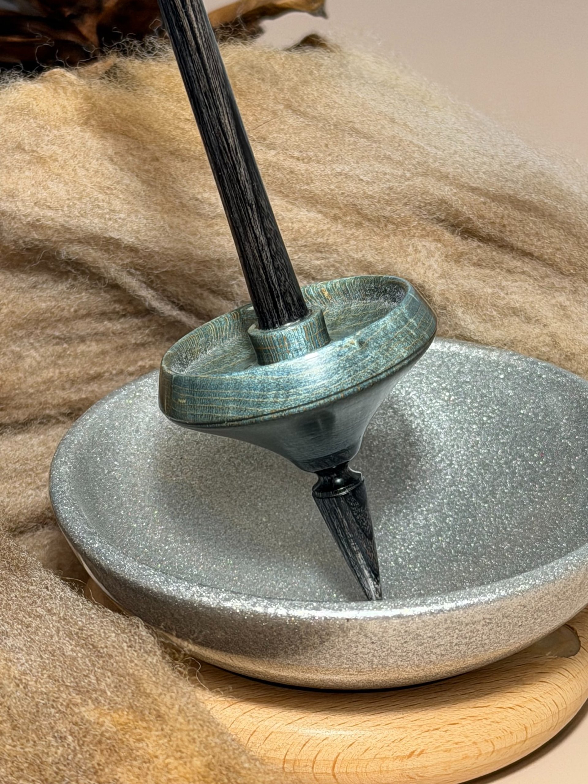 a close up of a black and brown abstract painting