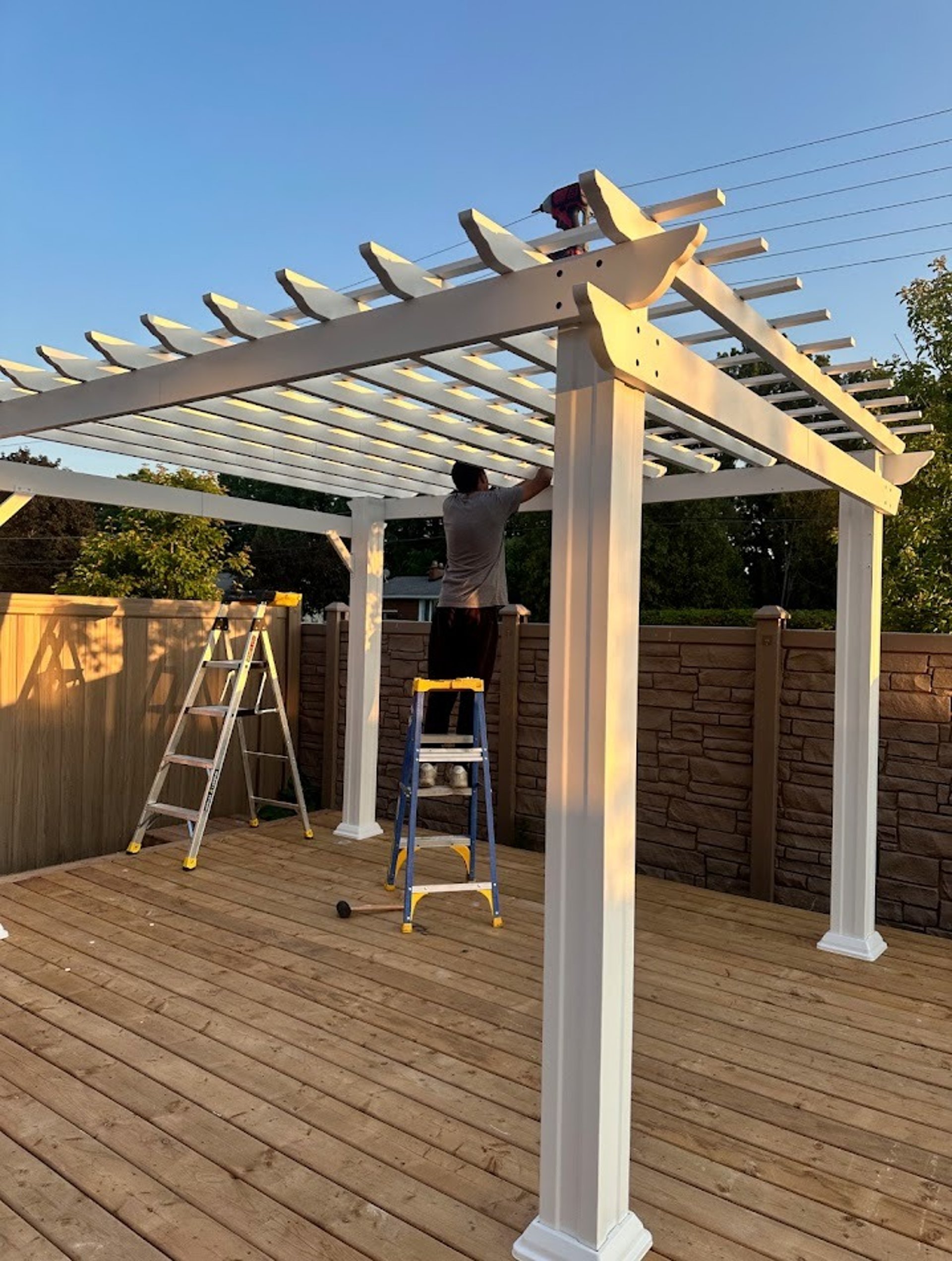 man wearing black jacket holding rod