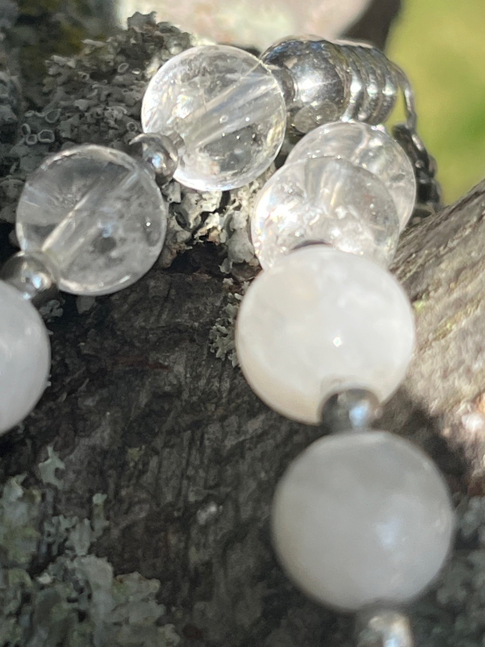 a group of white beads hanging from a string