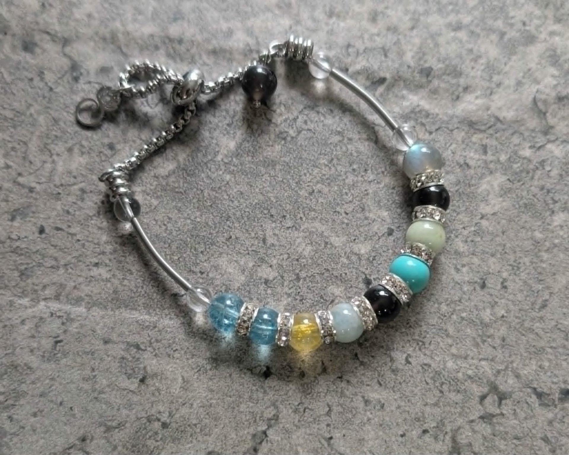 a close up of a bracelet on a table