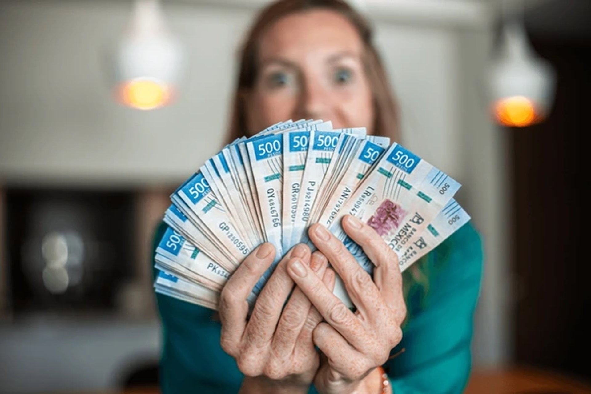 a close up of a red and white bill