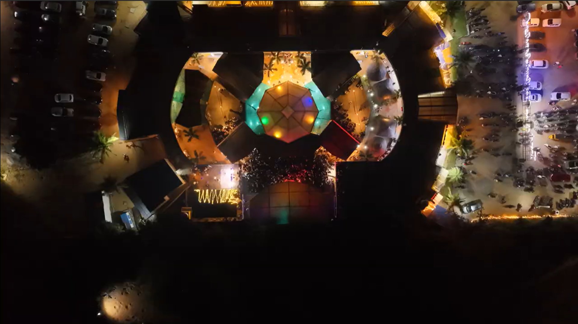 an abstract photo of a curved building with a blue sky in the background