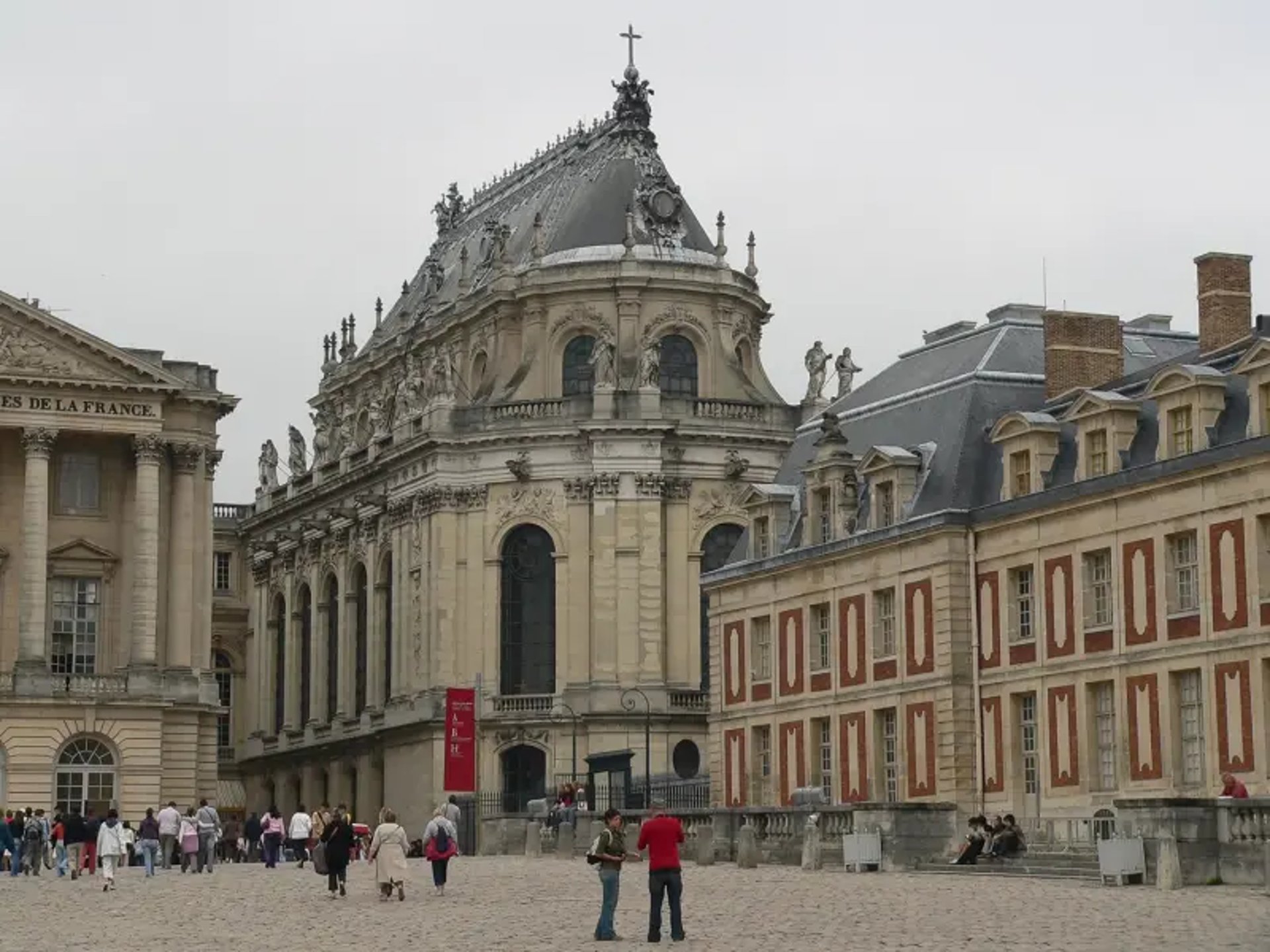 an abstract photo of a curved building with a blue sky in the background