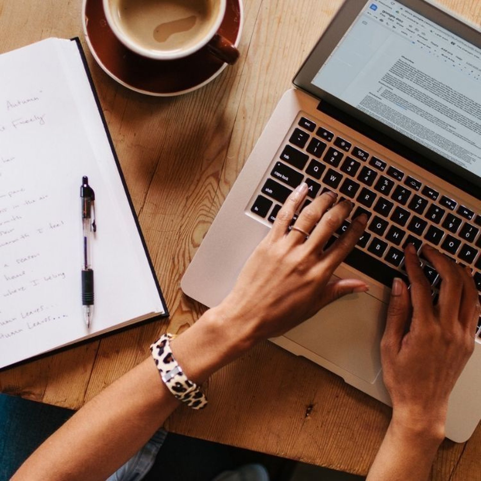 a laptop and a cell phone on a desk