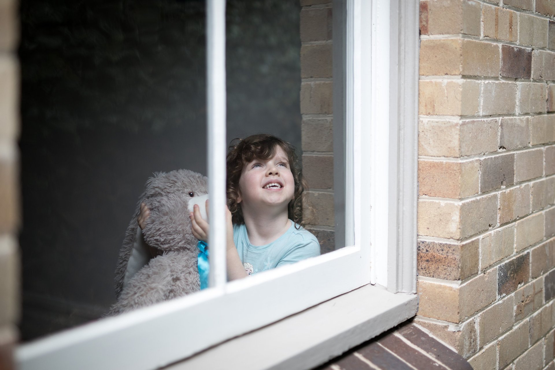 woman wearing yellow long-sleeved dress under white clouds and blue sky during daytime