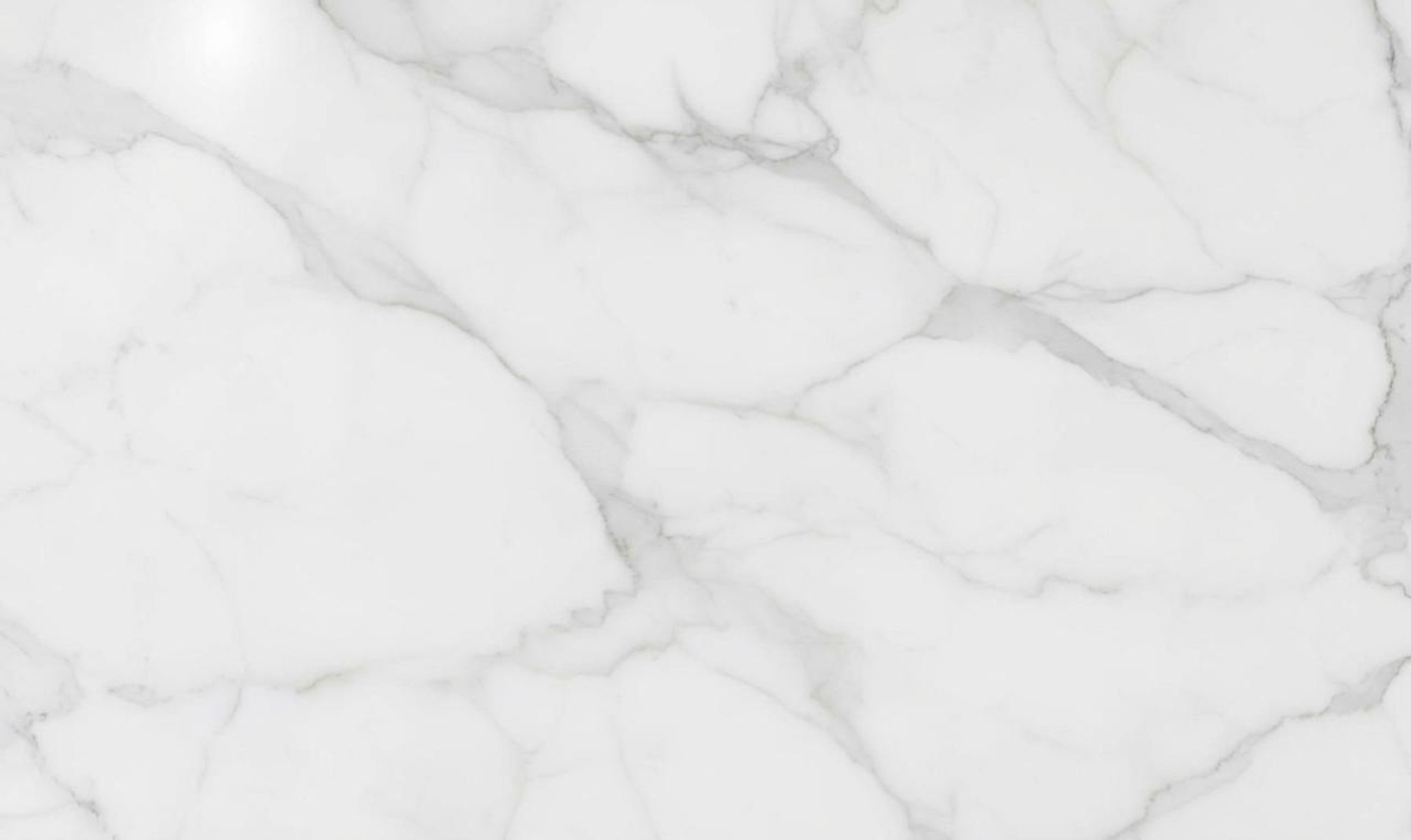 a person riding a snowboard down a snow covered slope